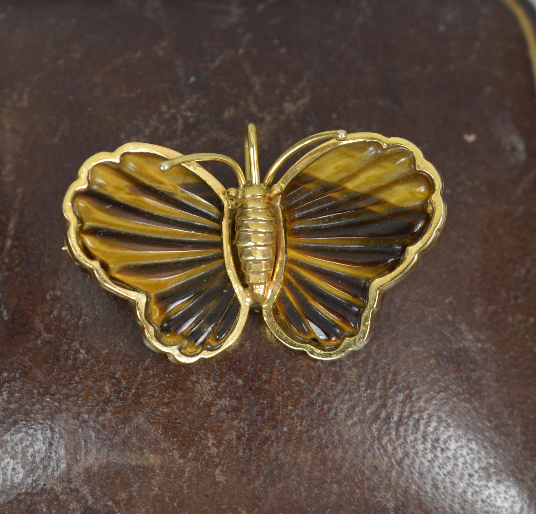 A very well made pendant or brooch in the form of a butterfly.
Solid 14 carat yellow gold example.
Set with a single tigers eye to each wing, finely carved.
Brooch fitting to reverse and bale to centre.
CONDITION ; Excellent. Very crisp design. Well