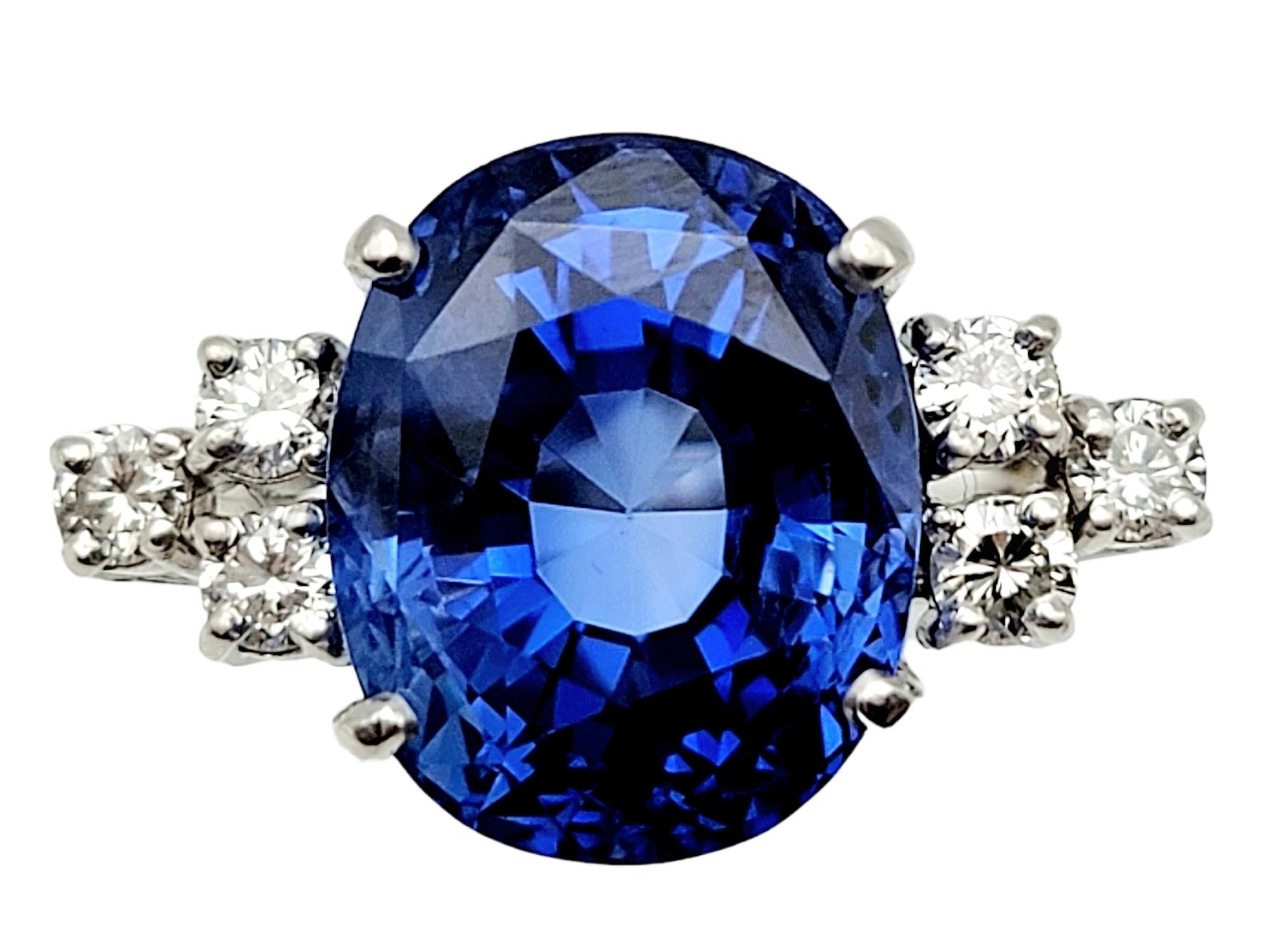 This absolutely jaw dropping, rare oval cut sapphire and diamond cocktail ring is one of those pieces that you will always adore. The massive, bright, and brilliant blue stone is mesmerizing because of the color, size, and clarity. It is set high ,