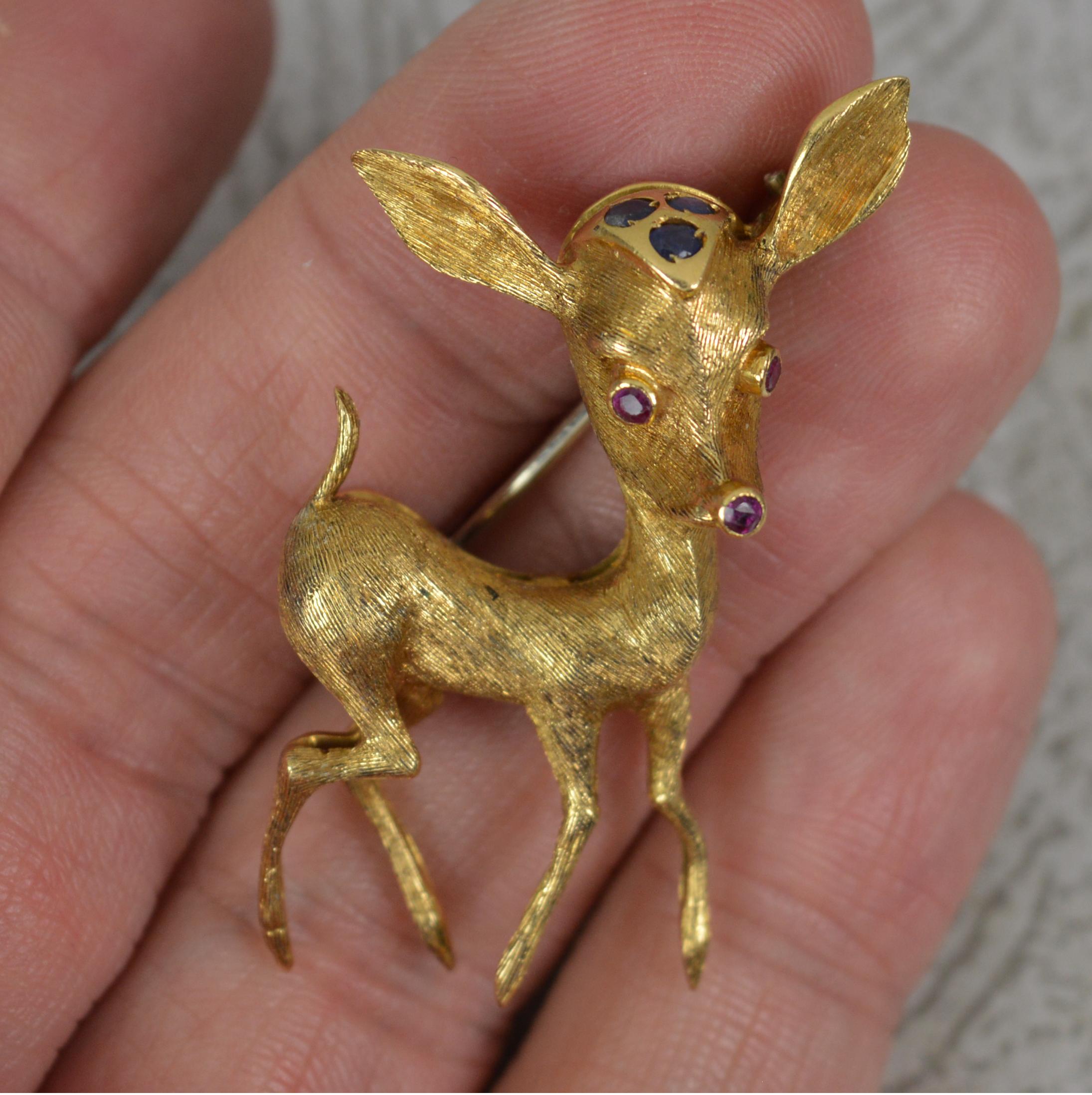 A very well made vintage brooch. Formed as Bambi. 
Solid and well made 18 carat gold example.
Well formed example, great gauge of gold. Set with round cut natural rubies and sapphires to head.
CONDITION ; Excellent. Very crisp design. Well set,