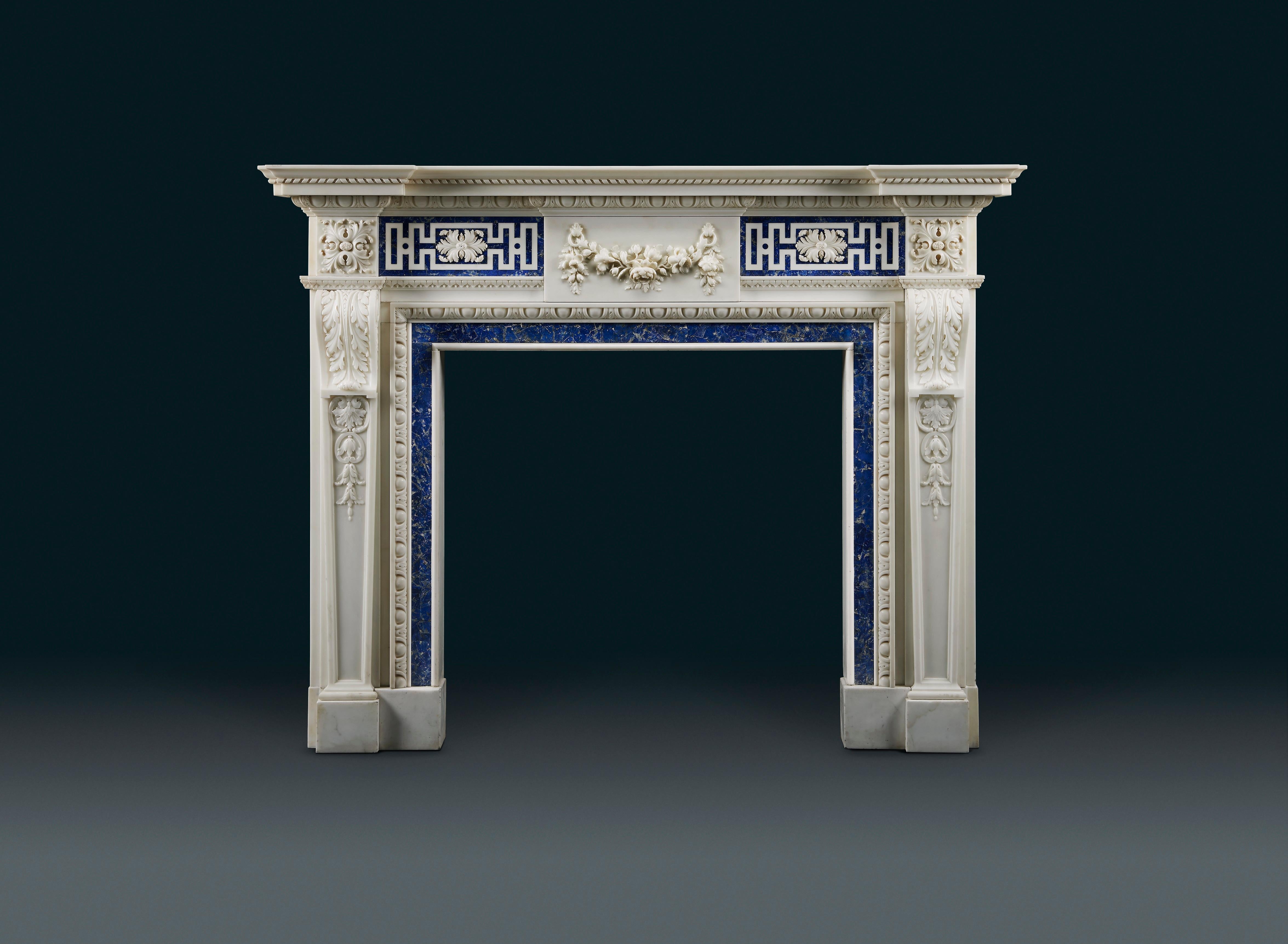 An impressive 18th century style carved statuary marble fireplace inlaid with the royal blue gemstone Sodalite, made by the famous London based White Allom Company for the Scottish seat of the fabulously wealthy shipping magnate Sir William Cayzer's