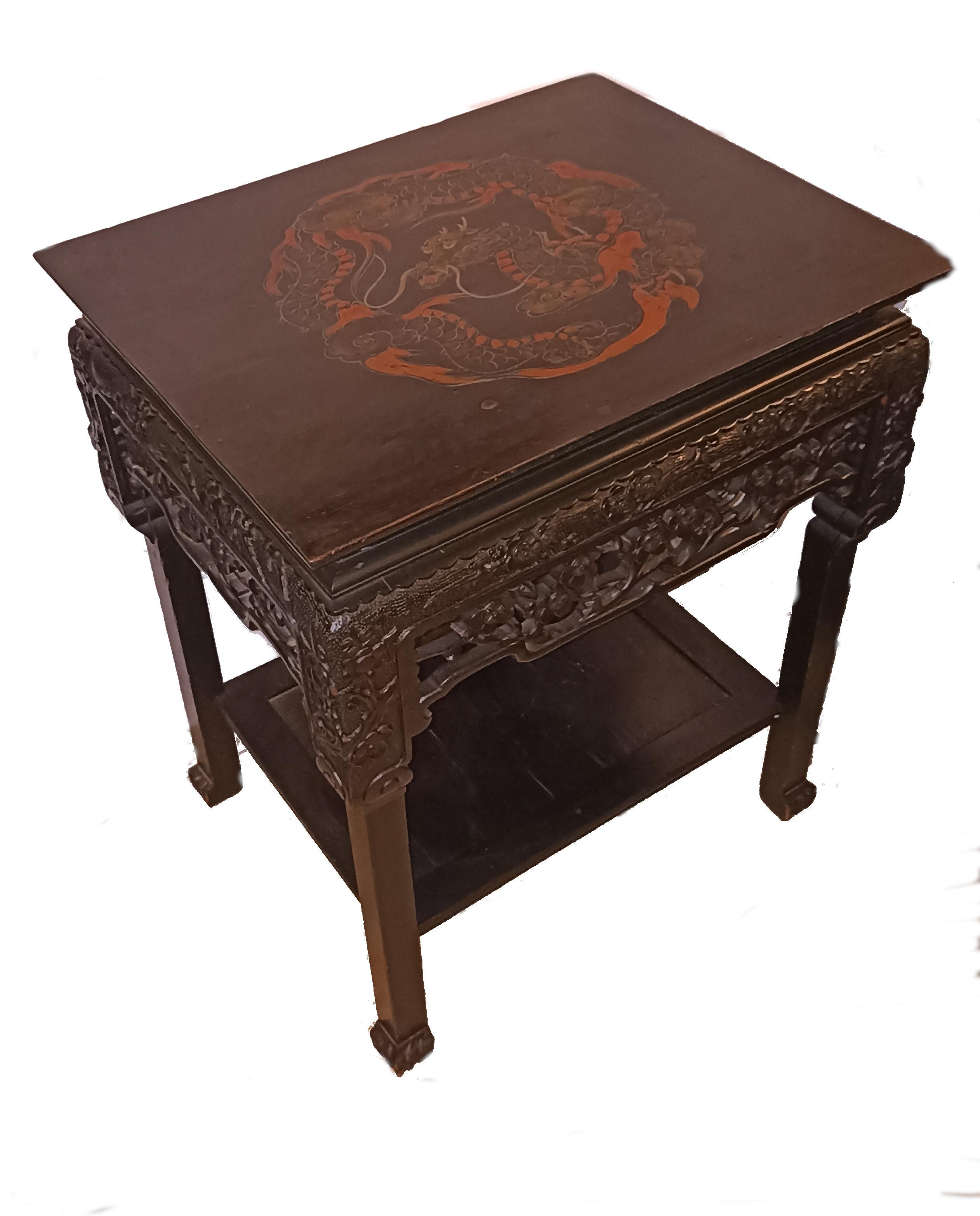 Qing Impressive 19th C. Carved and Black Lacquered Sidetable with Red Dragon Roundel For Sale