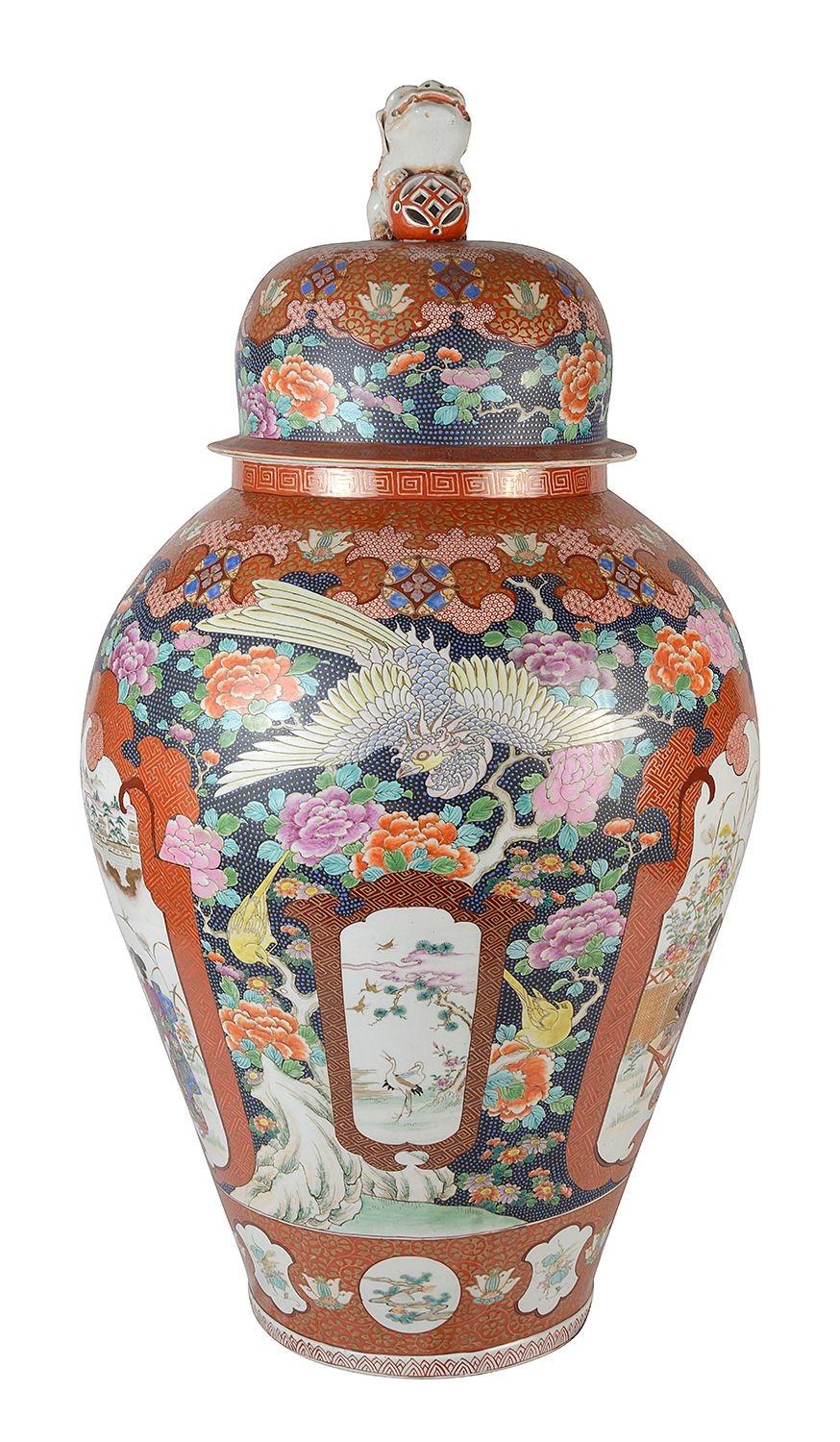 A very impressive 19th Century Japanese lidded Imari vase, having wonderful hand painted classical motif decoration, a Foo dog finial to the lid, inset panels depicting Geisha girls, exotic birds and flowers.

Batch 76 N/H