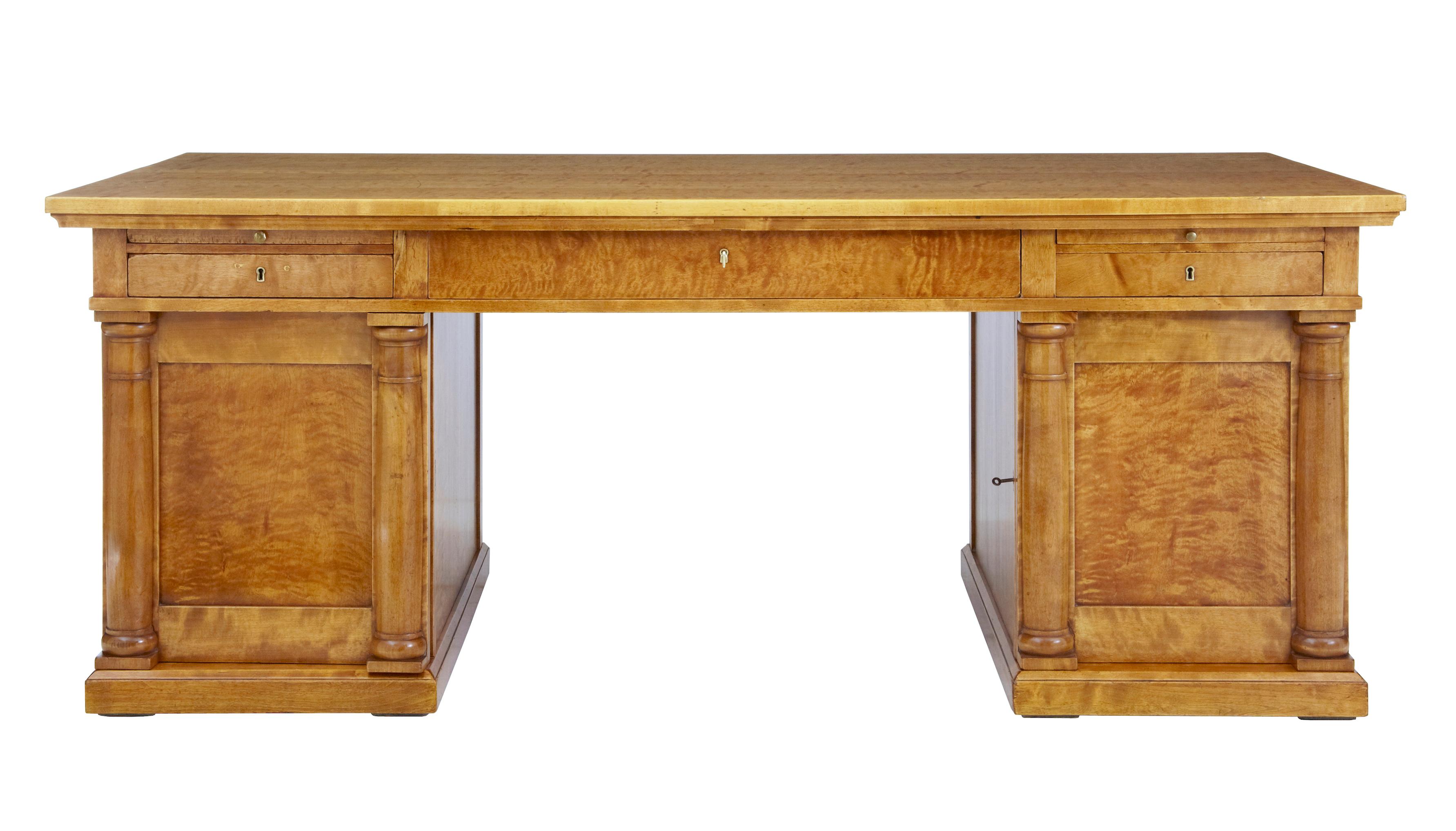Impressive 19th century large Swedish empire birch desk circa 1880.

Fine quality empire revival desk of large proportions circa 1880. Consisting of 3 parts, top and 2 pedestals. 

Large architectural top with a drawer and brushing slide on