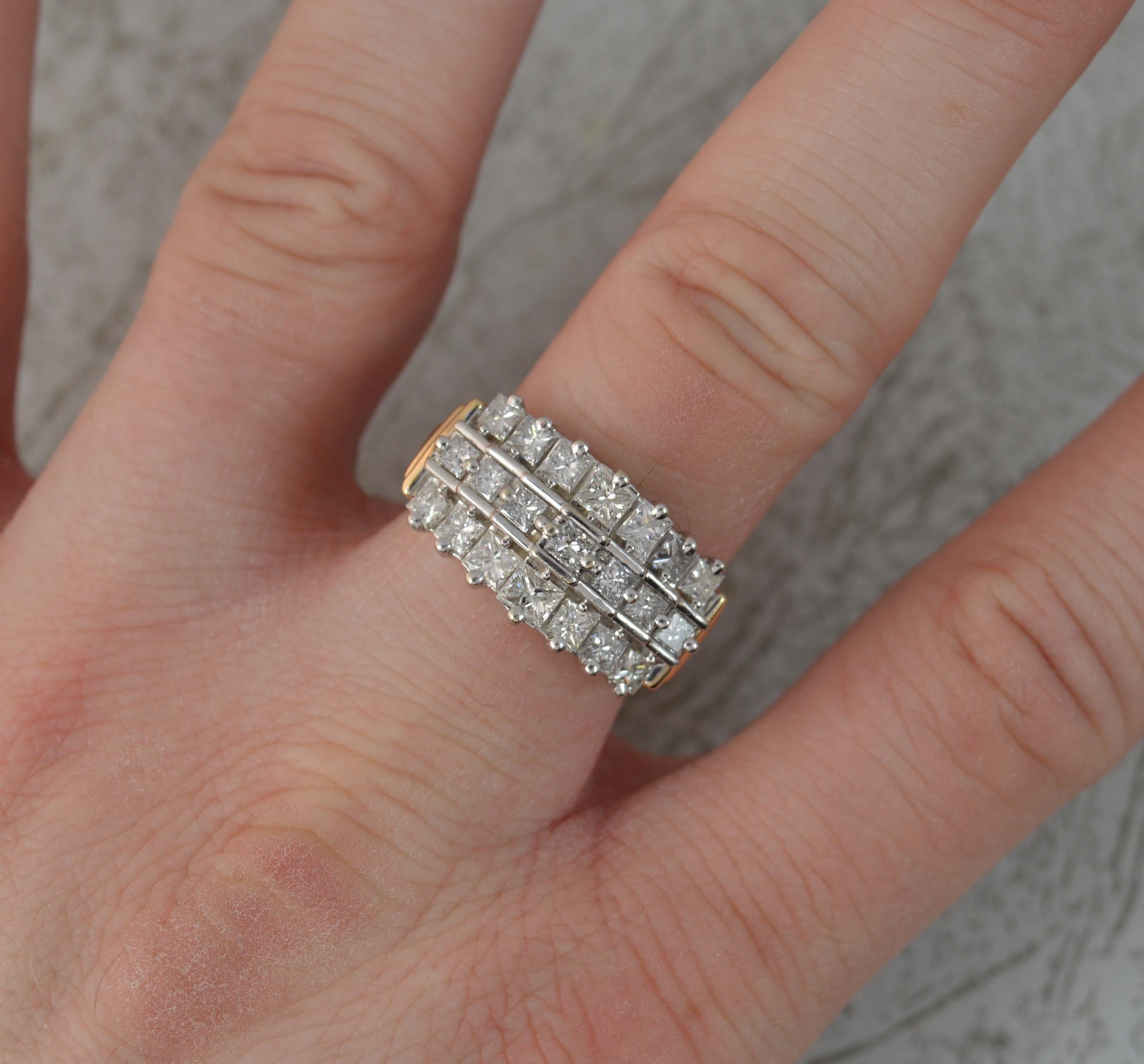 A stunning diamond cluster ring.
Solid 14 carat yellow gold example with white gold head setting.
A graduated or stepped cluster with three rows of princess cut diamonds. Approx 2.75 carats in total. Very clean, bright and sparkly.
20mm x 11mm