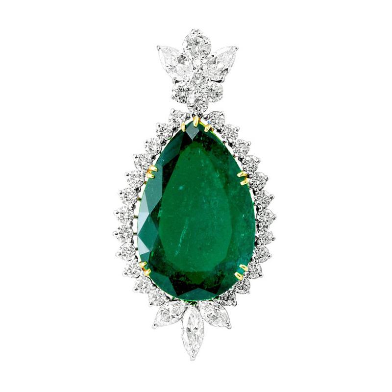 Impressive 41 carat Colombian Emerald ,Minor enhancement,  and Diamond Pendant
A classic and stunning pendant, set with a large pear-shape forty-one carat Colombian Emerald, with minor oil, set with thirty-four full-cut round and mixed cut pear and