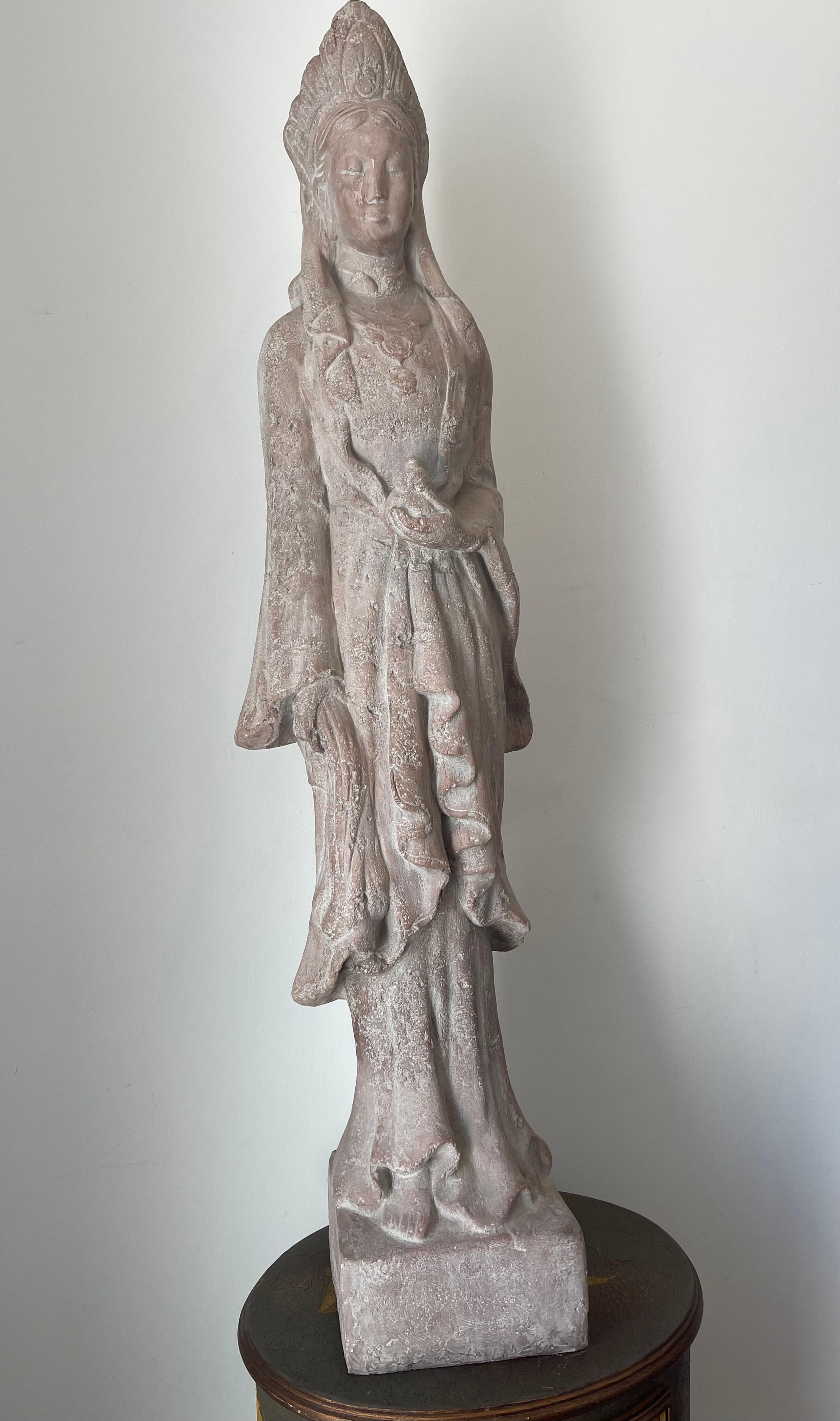 Antique impressive 50” high terracotta sculpture of Quan Yin , Buddha of Compassion. Stands tall and. Slender, figure of infinite grace, her gently composed features conveying the sublime selfishness and compassion, that have made her the favorite