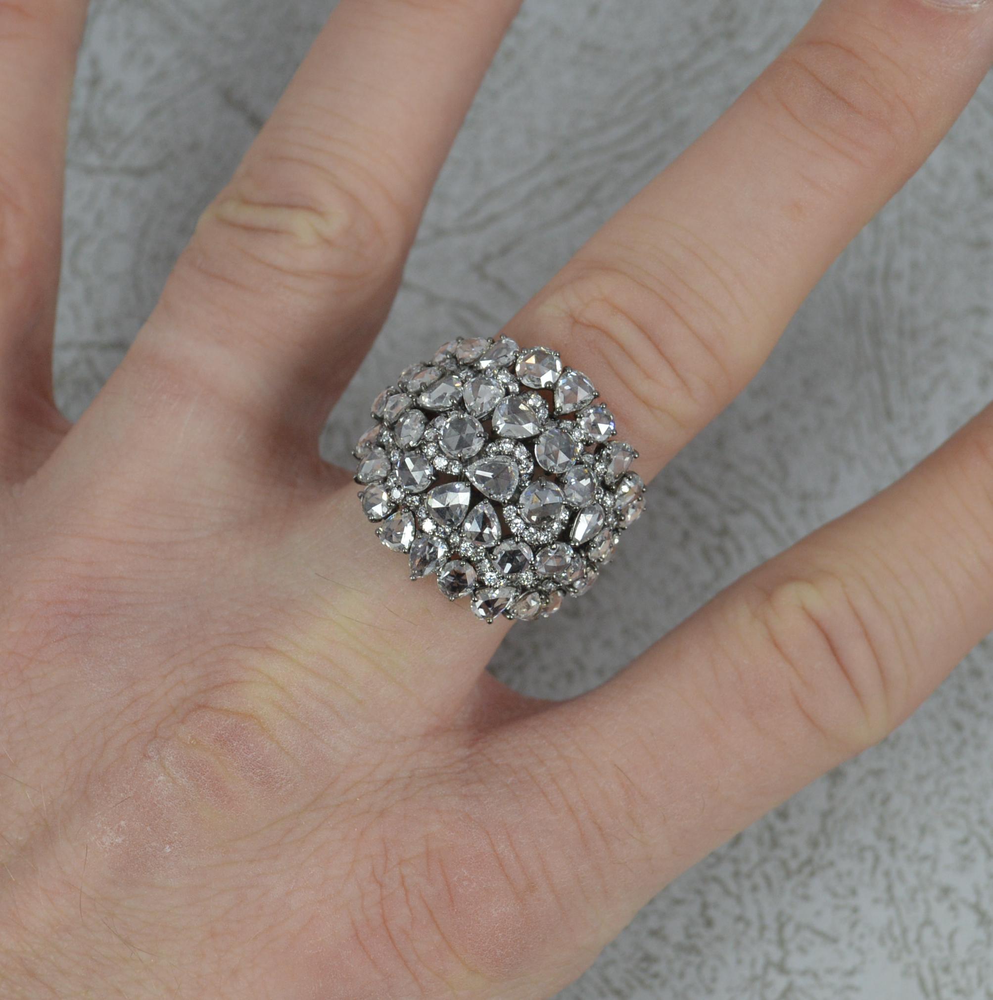 One breathtaking diamond ring. A true cocktail cluster ring.
The cluster head comprised of many natural rose cut diamonds of round and pear shape with smaller round brilliant cut diamonds in between. Total carat weight of 5.46 carats as confirmed to