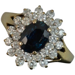 Impressive 9 Carat Gold Blue Sapphire and 0.75 Carat Diamond Cluster Ring