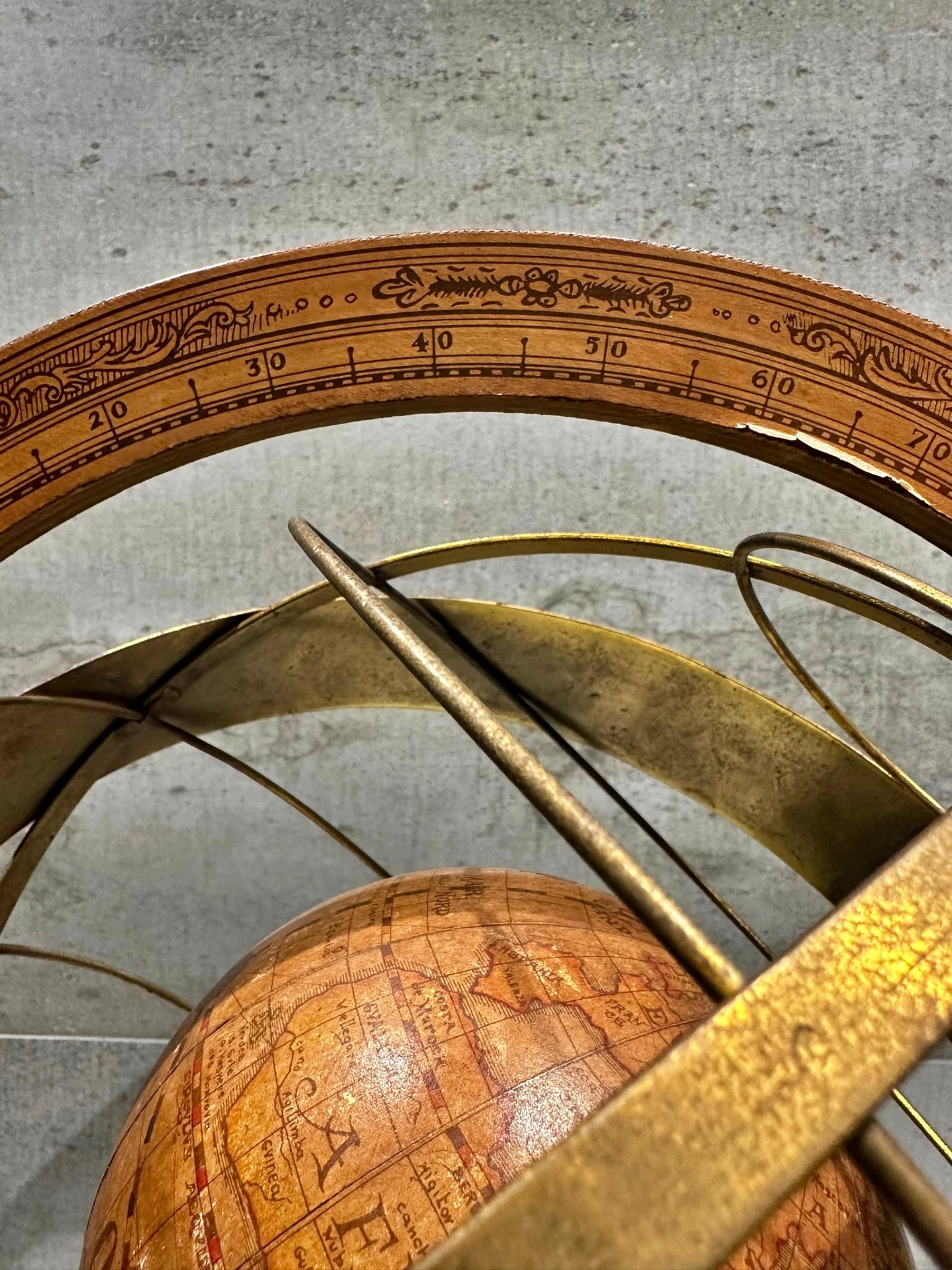 Impressive and Ancient Italian Armillary Sphere from early 20th century, 
handcrafted in wood and metal/golden brass with a base on 3 solid wood legs. 
Certificate of authenticity. 
A true unique collector's item. 
Measurements: 90 cm high, 45