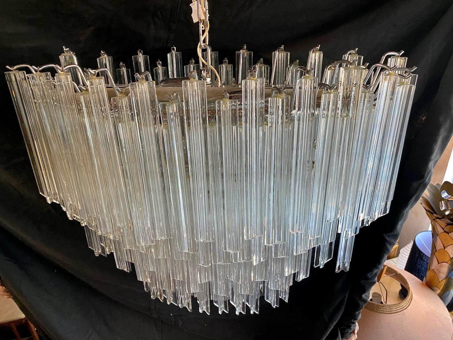 Wow what a beautiful crystal chandelier, the colors are clear and neutral, but because of the flash it gives a different perspective, it is impressive and oval is a rare shape. 

       