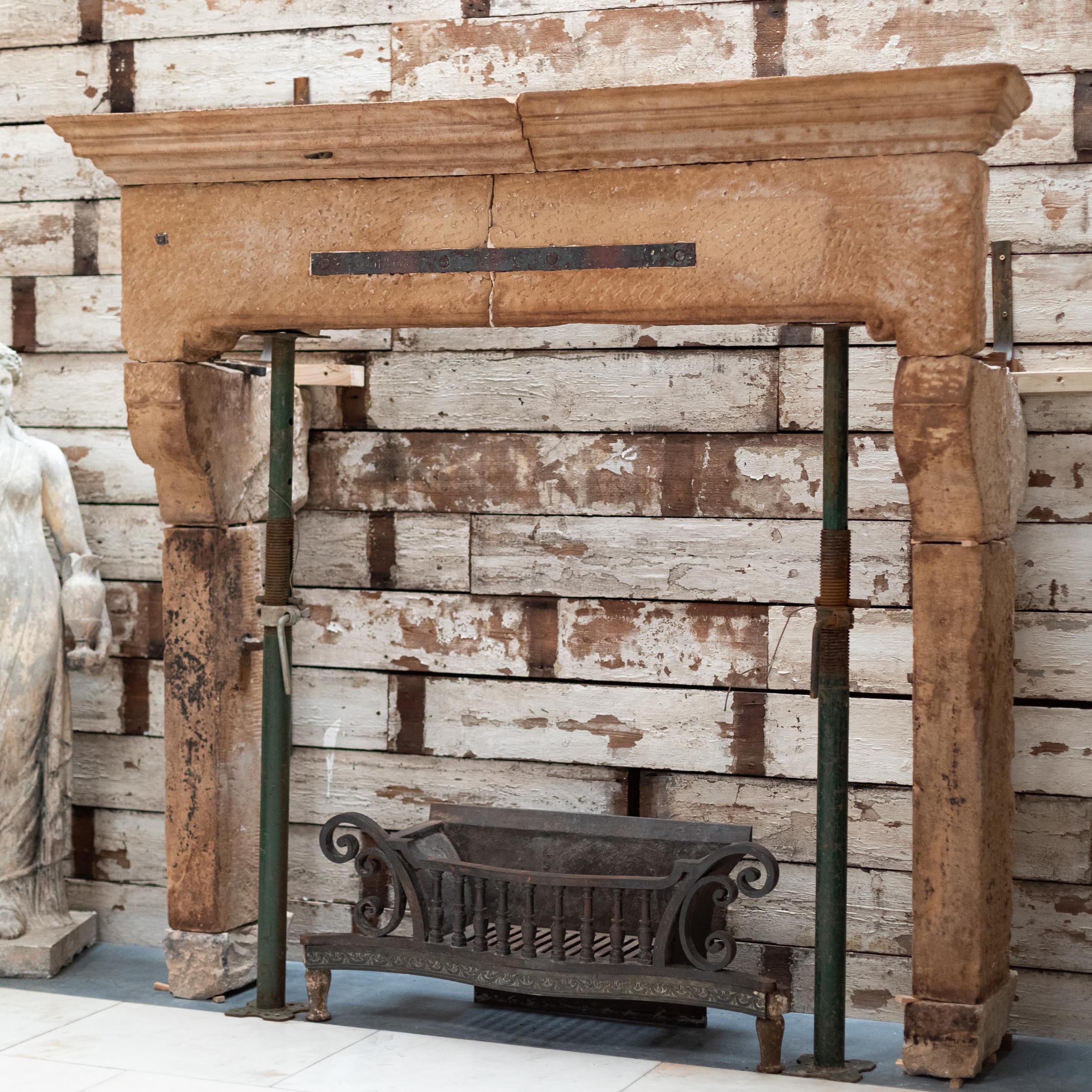 This spectacular original 18th Century fireplace surround has been intricately carved from English stone.

The imposing form and rich patina of the English stone make for a feature piece for a space matching the scale. The curved jambs that support