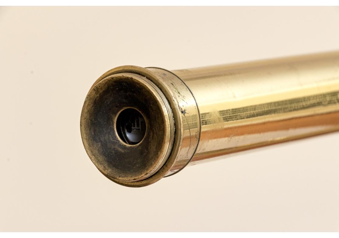 Large antique Dolland & Co brass telescope with labeled wood box with accessories as shown.  Engraved brass lens G. Dollond, London. Comes with tall wooden stand or smaller brass tripod stand. The label reads 