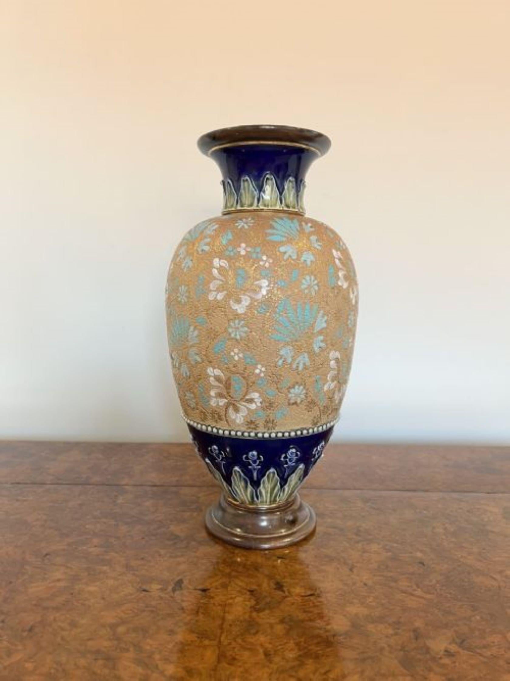 Impressive antique Victorian Doulton vase having an impressive antique Victorian Doulton vase decorated with blue and white flowers on a golden ground together with acanthus leaf decoration to the neck and body, with impressed marks to the base.