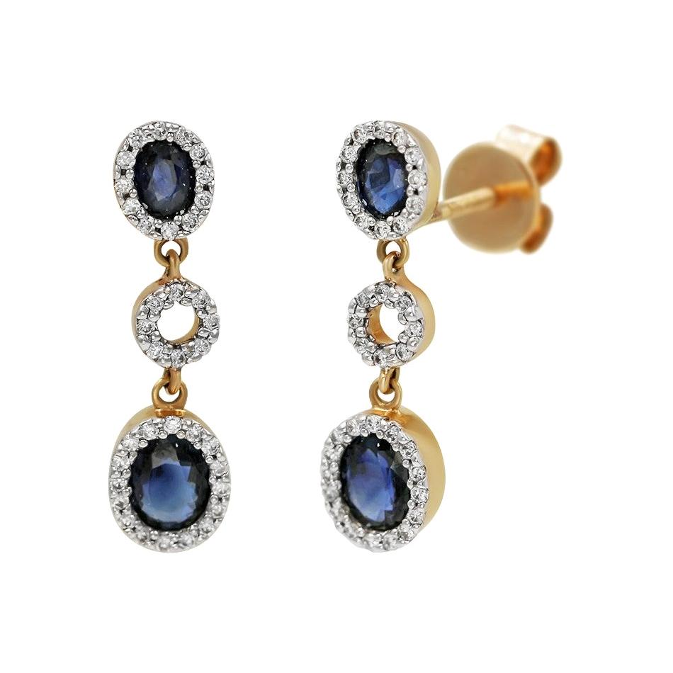 Impressionnantes boucles d'oreilles en goutte en or blanc avec saphir bleu et diamant