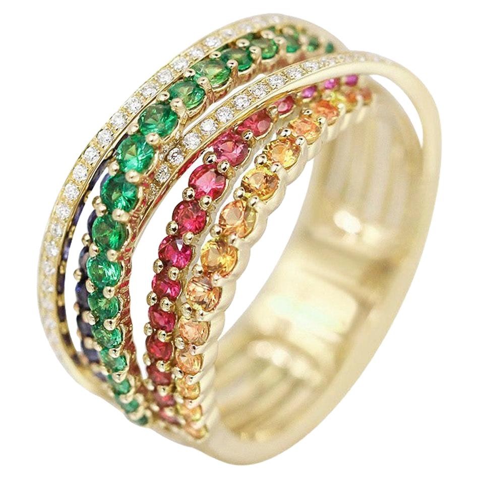 Impressionnante bague en or jaune avec saphir bleu, rubis, tsavorite et diamants