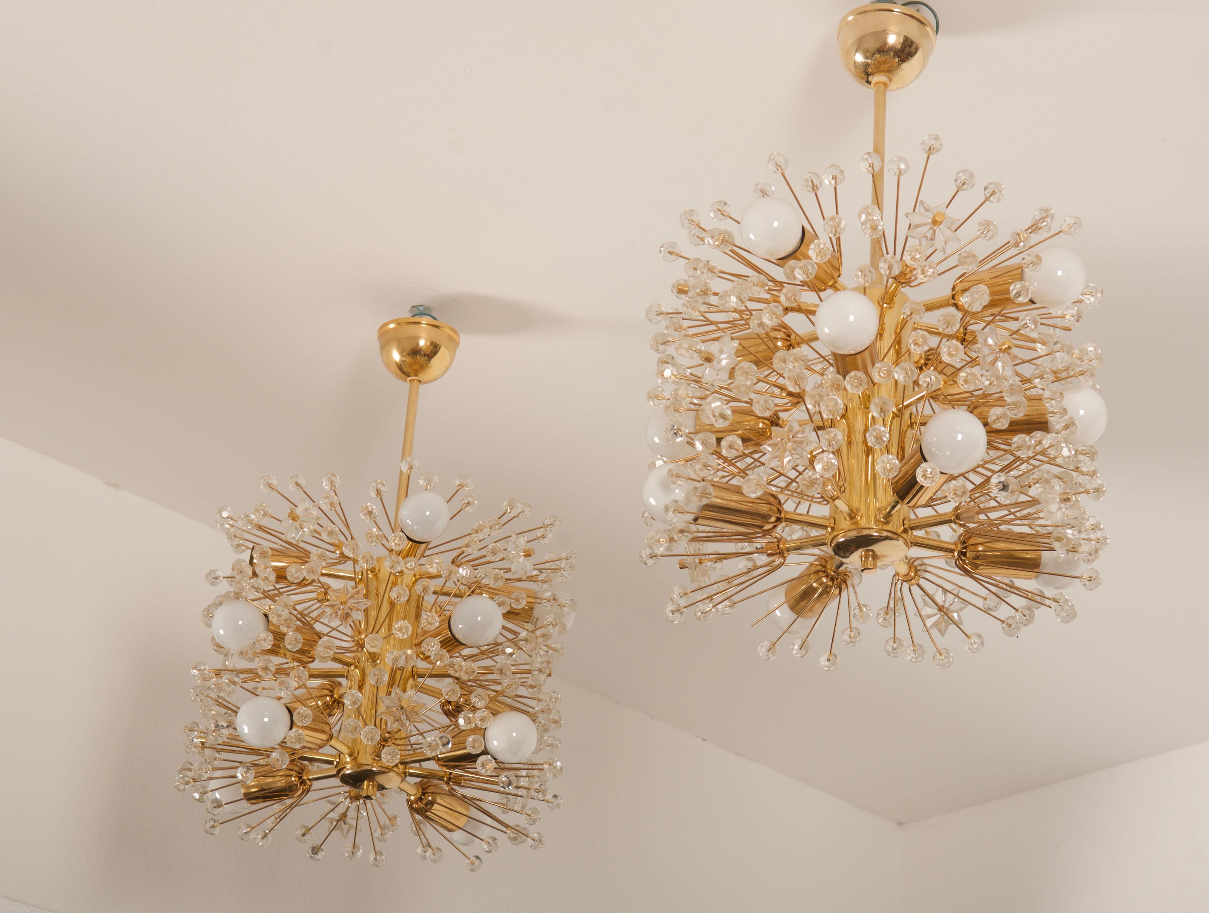 Emil Stejnar snowball chandelier form 1960s, brass construction and gold colored socket covers accented with crystal flowers and beads. 
Twelve E14 sockets.
Two pieces available price / piece.
 