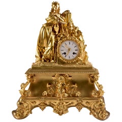 Antique Impressive bronze fire-gilt pendulum clock, with a beautiful woman, 1820