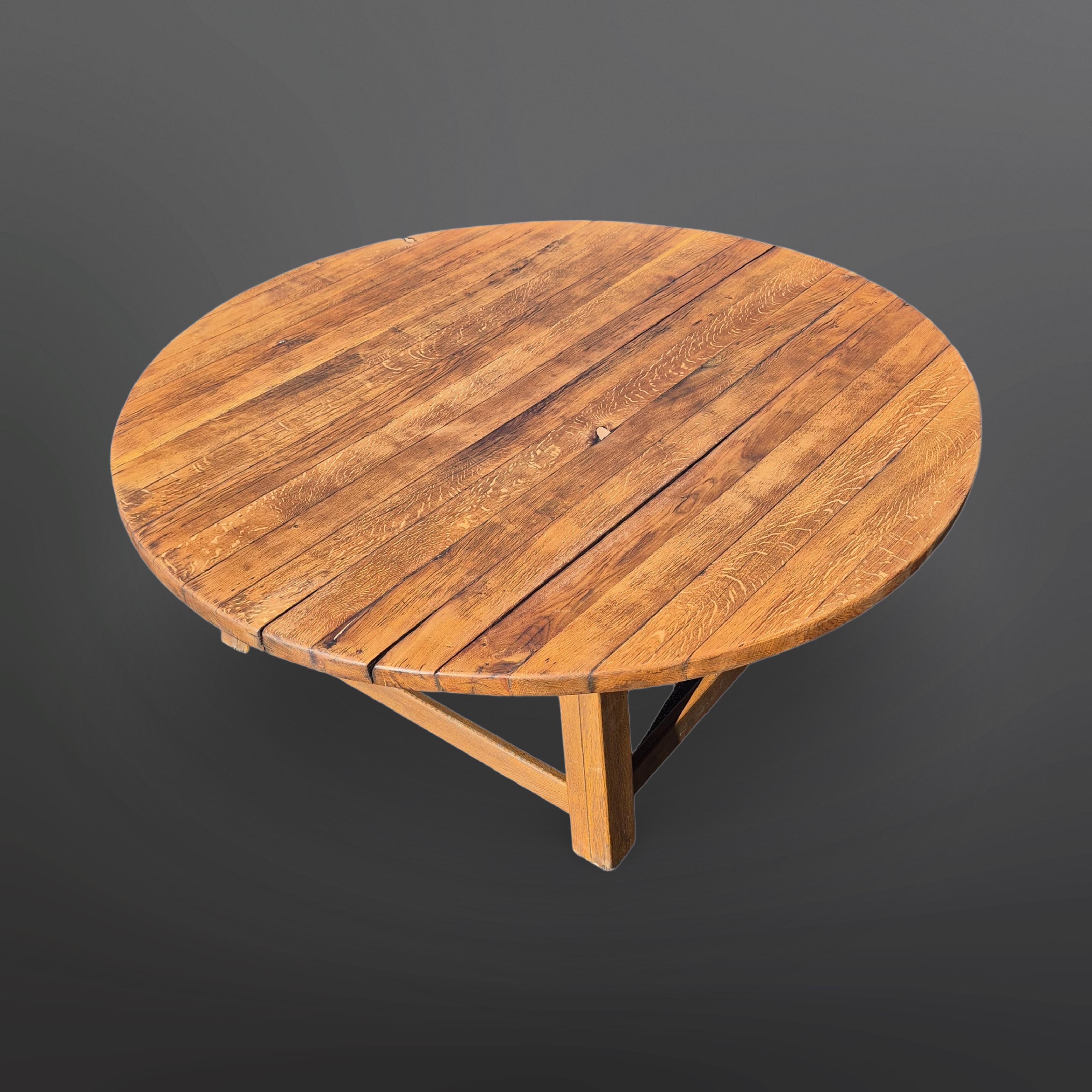 Impressive handcrafted dining table. The round top measures 200cm in diameter. It sits on an oak base.
The top was custom made in the late 60s for the original owner.
Originally a garden table it has gained lots of patina and character through the