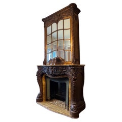 Cheminée et Trumeau en bois sculpté avec accents de marbre jaune de Sienne