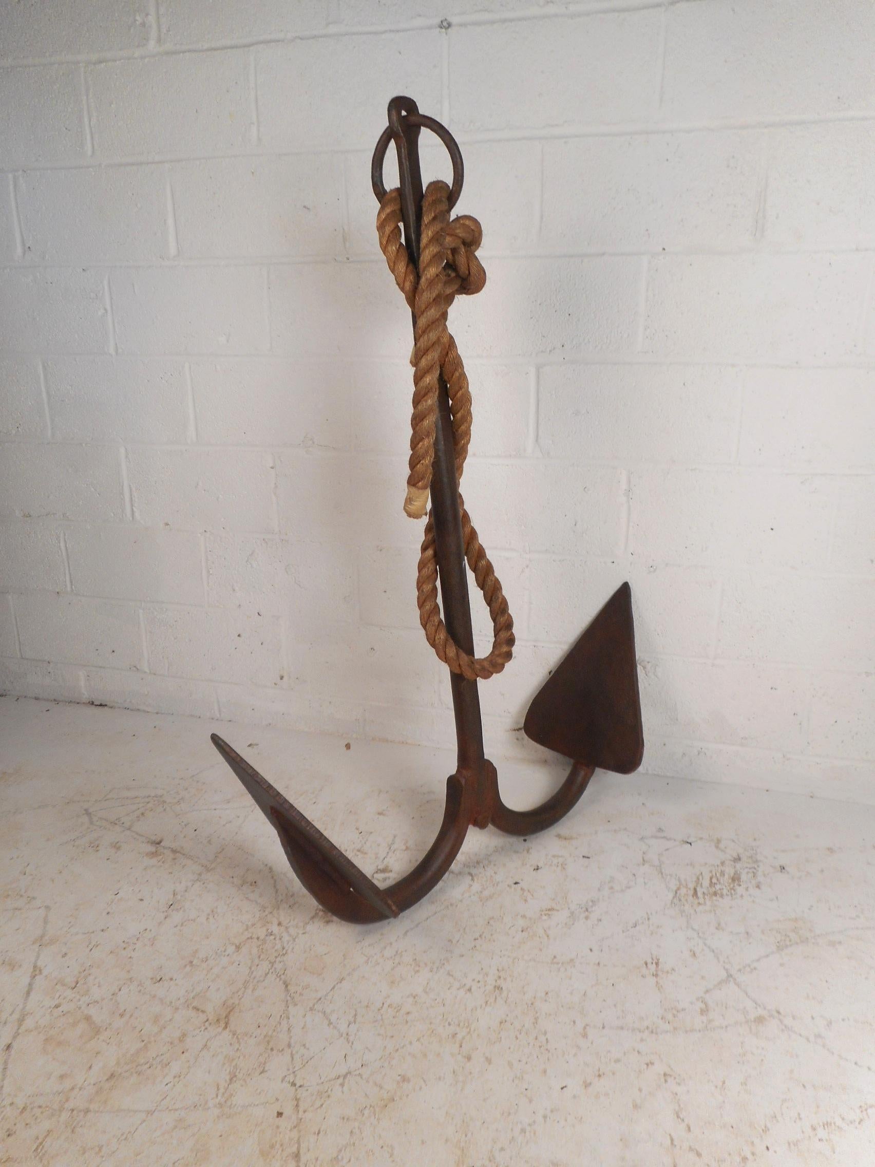 This amazing turn of the century cast iron anchor makes the perfect decorative piece for exterior of any home, business, or office. This heavy anchor stands at 54 inches tall and 39 inches wide. A real nautical piece of a history that is sure to
