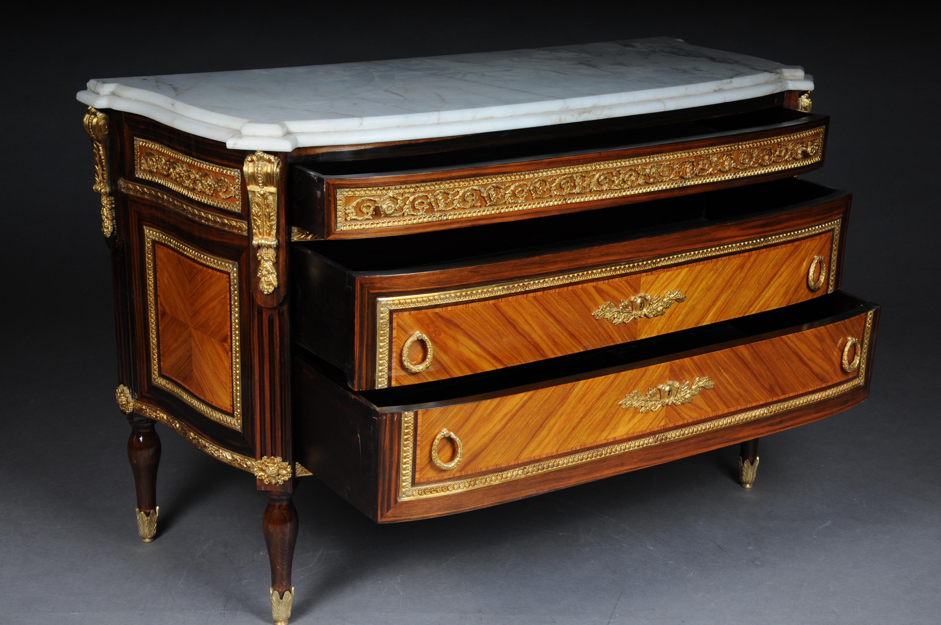 Impressive chest of drawers sideboard in Louis XVI.

 massive softwood. Slightly curved body ending on conical baluster legs in bronze feet. In the front three drawers, the two lower drawers are mirror-veneered. The top narrow drawer is with a