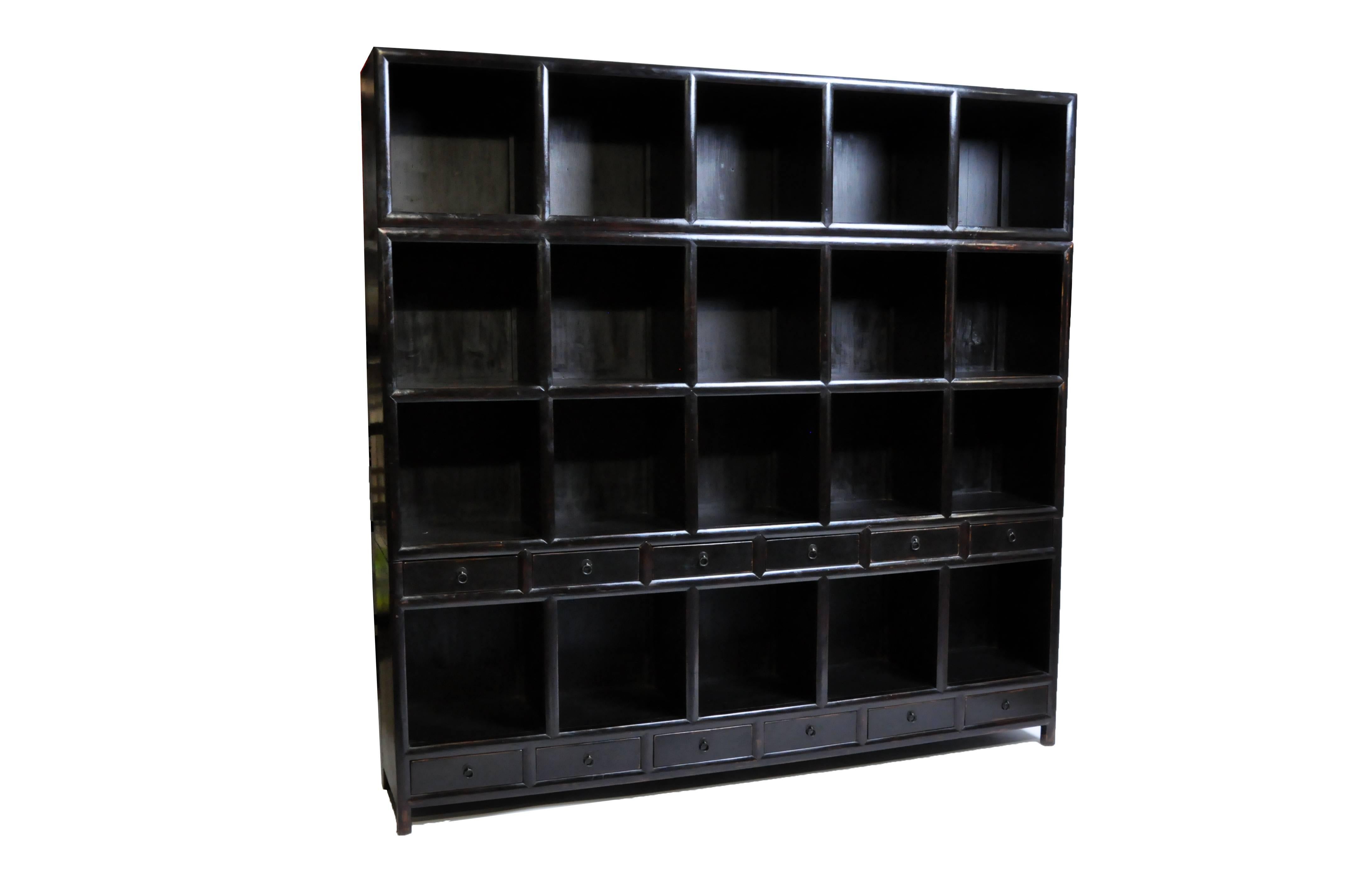 This impressive display cabinet is from Hebei, China and was made from reclaimed poplar wood. This piece features mortise and tenon joinery, twelve drawers, and display shelves for ample storage. You can also customize it and make it your own. Wood,