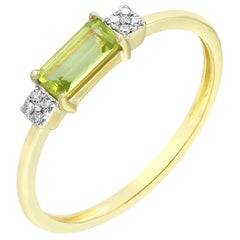 Impressionnante bague en or jaune avec chrysolite et diamants