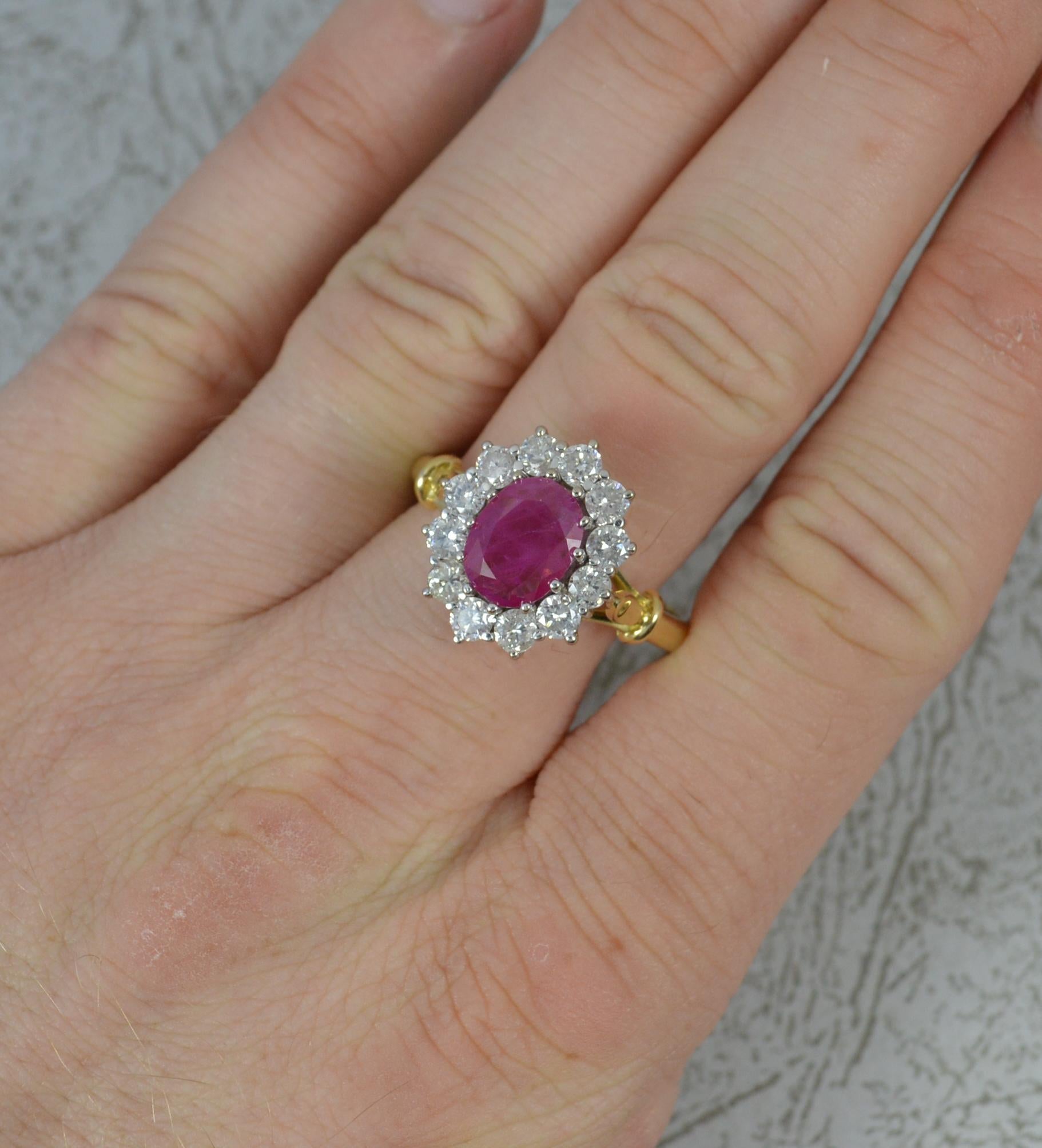 A beautiful classic Ruby and Diamond ring.
Solid 18 carat yellow gold shank and white gold head setting.
Designed with an oval cut ruby, 7mm x 9mm in multi claw setting with a full border of 12 natural round brilliant cut diamonds to total 1.20
