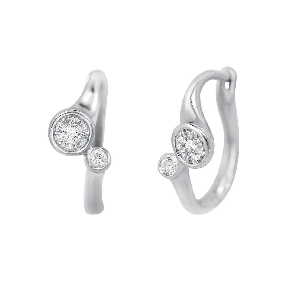 Ring White Gold 14 K (Matching Earrings Available)

Diamond 7-RND-0,08-G/VS2A 
Diamond 1-RND-0,04-G/VS1A

Weight 2.2 grams
Size 16.5

With a heritage of ancient fine Swiss jewelry traditions, NATKINA is a Geneva based jewellery brand, which creates