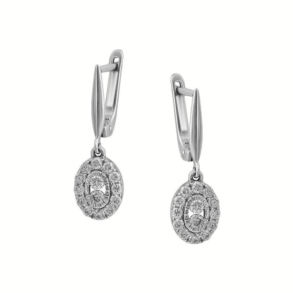 Ring White Gold 14 K (Matching Earrings Available)

Diamond 12-RND-0,2-G/SI1A
Diamond 1-RND-0,09-H/VS2A 
Diamond 2-RND-0,05-G/SI1A

Weight 1.8 grams
Size 16.5

With a heritage of ancient fine Swiss jewelry traditions, NATKINA is a Geneva based