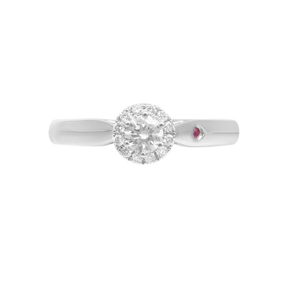 Ring White Gold 14 K 

Diamond  1-RND-0,19-G/VS1A
Diamond 12-RND-0,07-G/VS2A 
Ruby 1-0,01ct

Weight 2.1 grams
Size 17

With a heritage of ancient fine Swiss jewelry traditions, NATKINA is a Geneva based jewellery brand, which creates modern