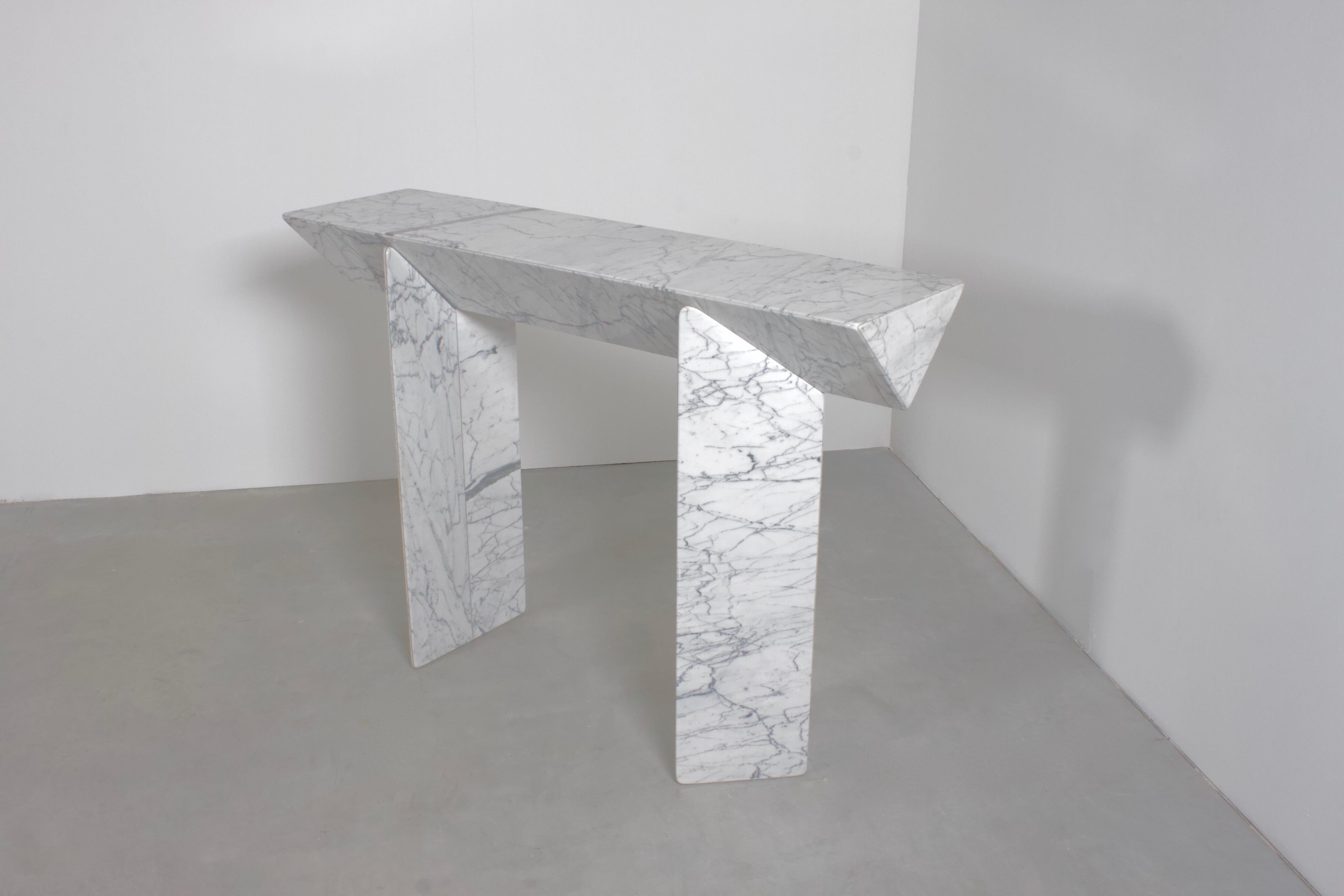 Stunning Giulio Lazzotti console in excellent condition.

This table consists of a white Calcutta marble top and bases.

The top is made in a triangular shape and rests on triangular shaped bases.

The bases can be placed under the top in different