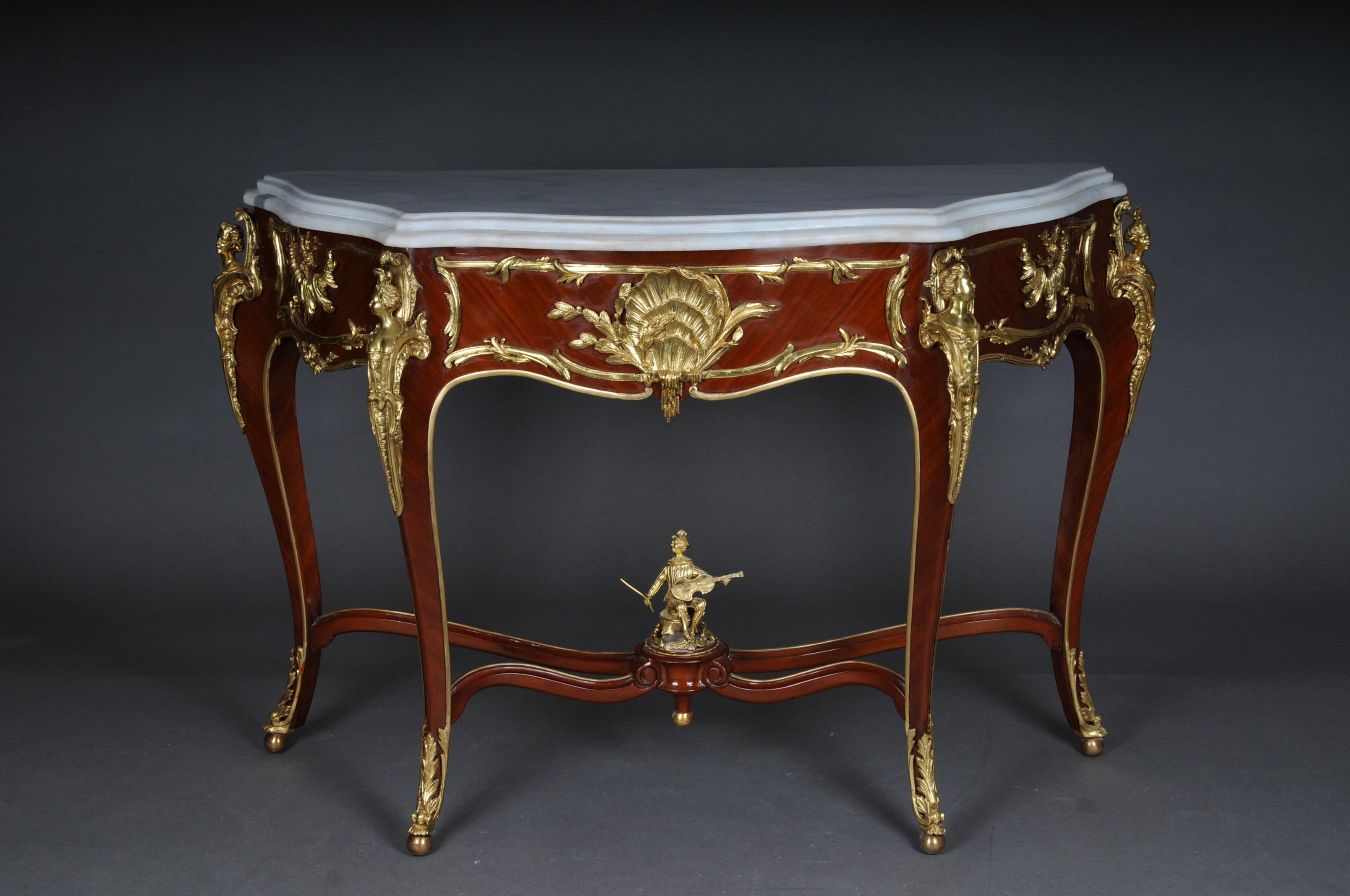 Impressive console/sideboard in the Louis XV after Francois Linke, Paris

Beautiful Francois Linke console table, 20th Century The shaped brèche beige marble top above the frieze centered by a scallop shell,
flanked by four female busts raised on