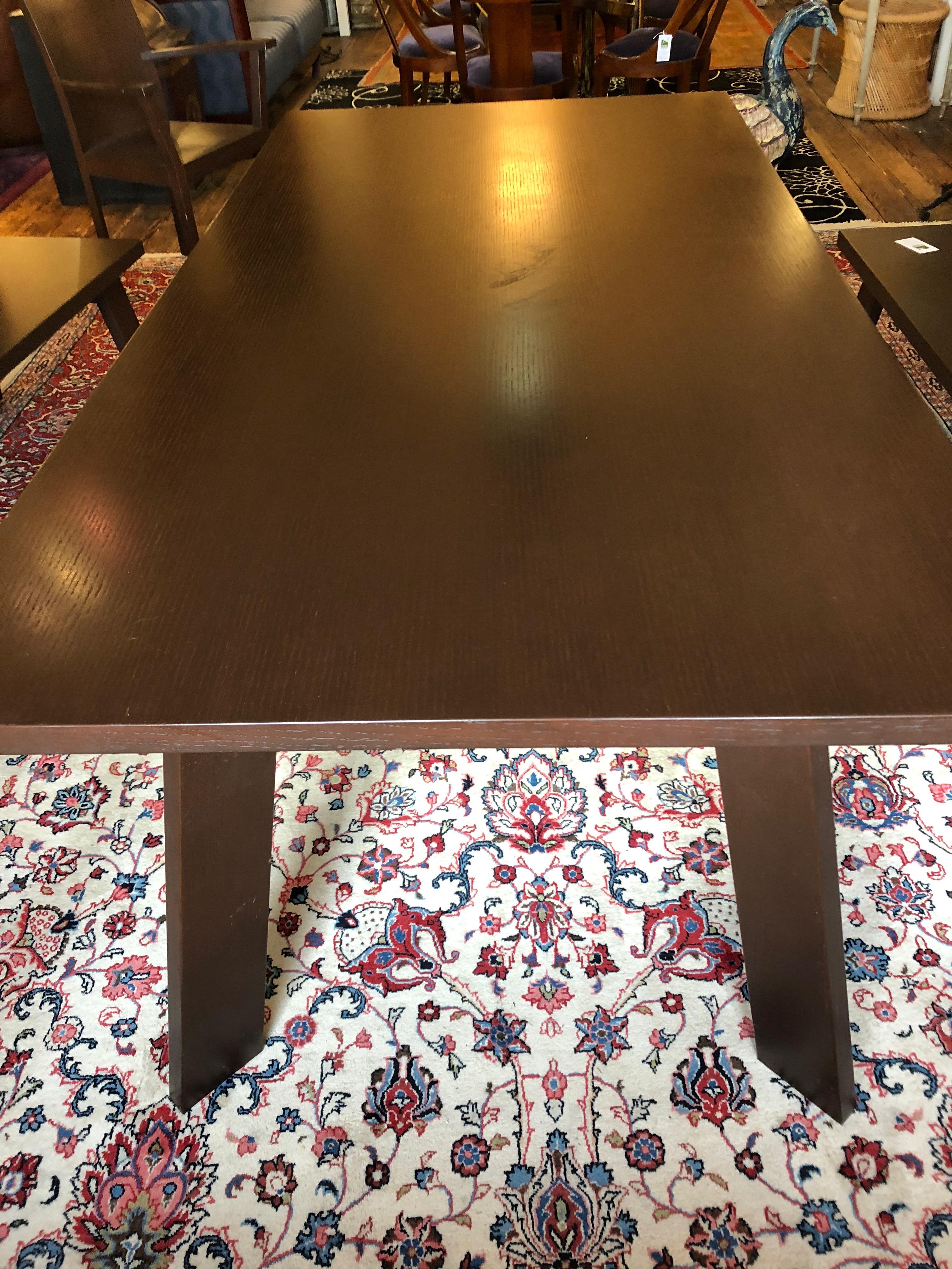 Beautiful modern walnut dining table with sophisticated modern design having cool splayed legs and 1