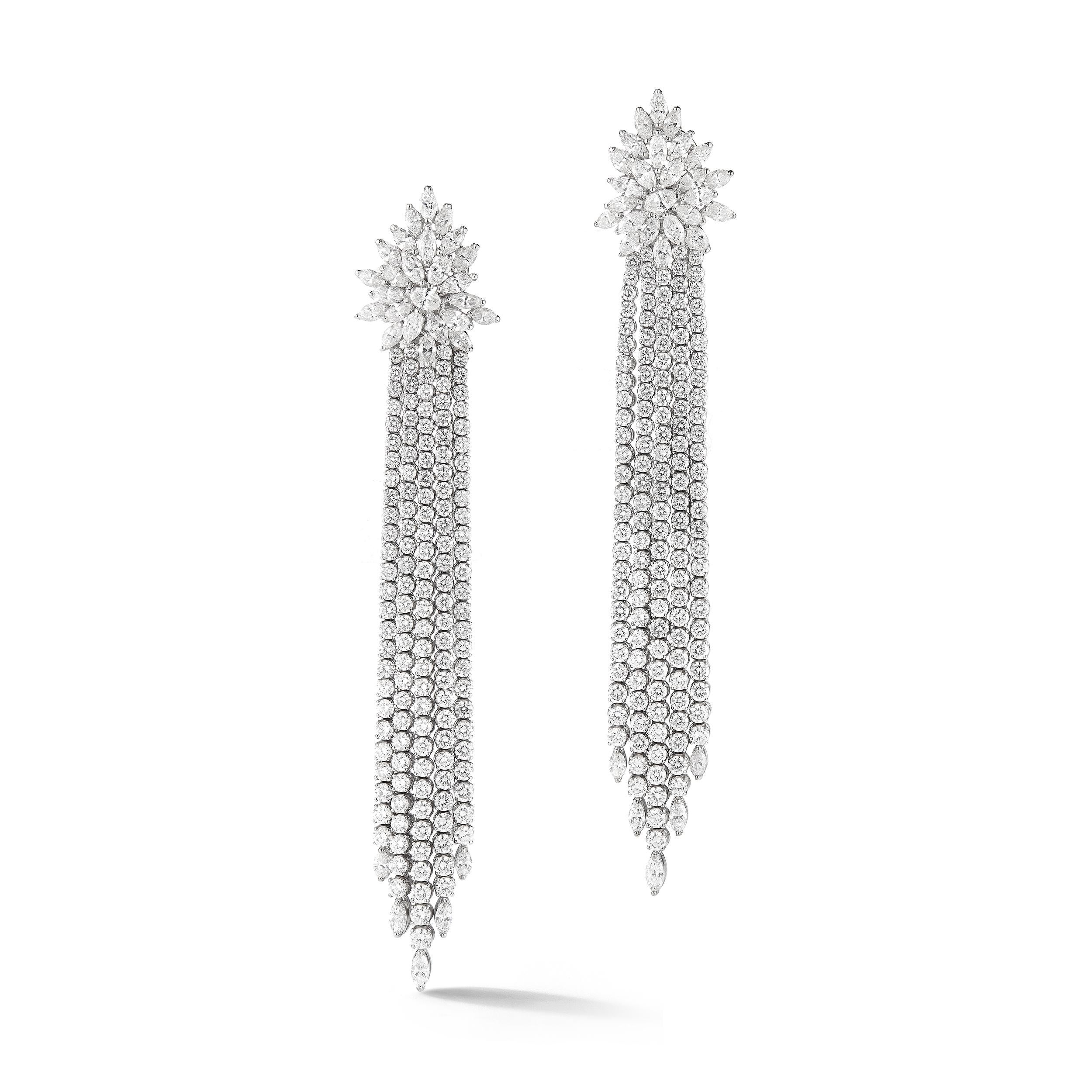 Impressive Diamond earrings, set with 27.41 carat of round Diamonds F color VS1 clarity. Can enjoy it during a Black Tie event or just a quite dinner.