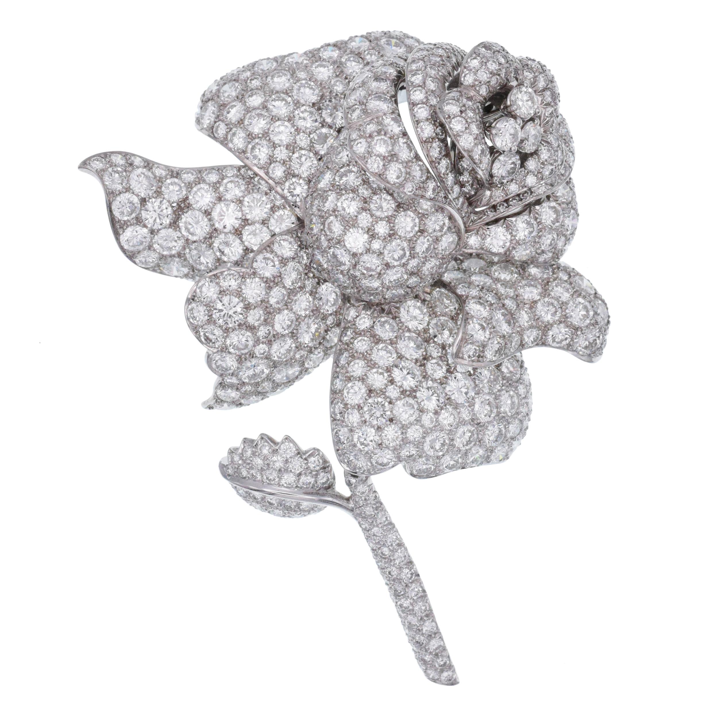 Diamond, White Gold Brooch This diamond brooch has round diamonds weighing approximately 25ct
(Color: G/H, Clarity:VS) total all set  in 18k white gold.
Measurements: 3-1/8 inches x 2-9/16 inches Weight: 46.40 grams