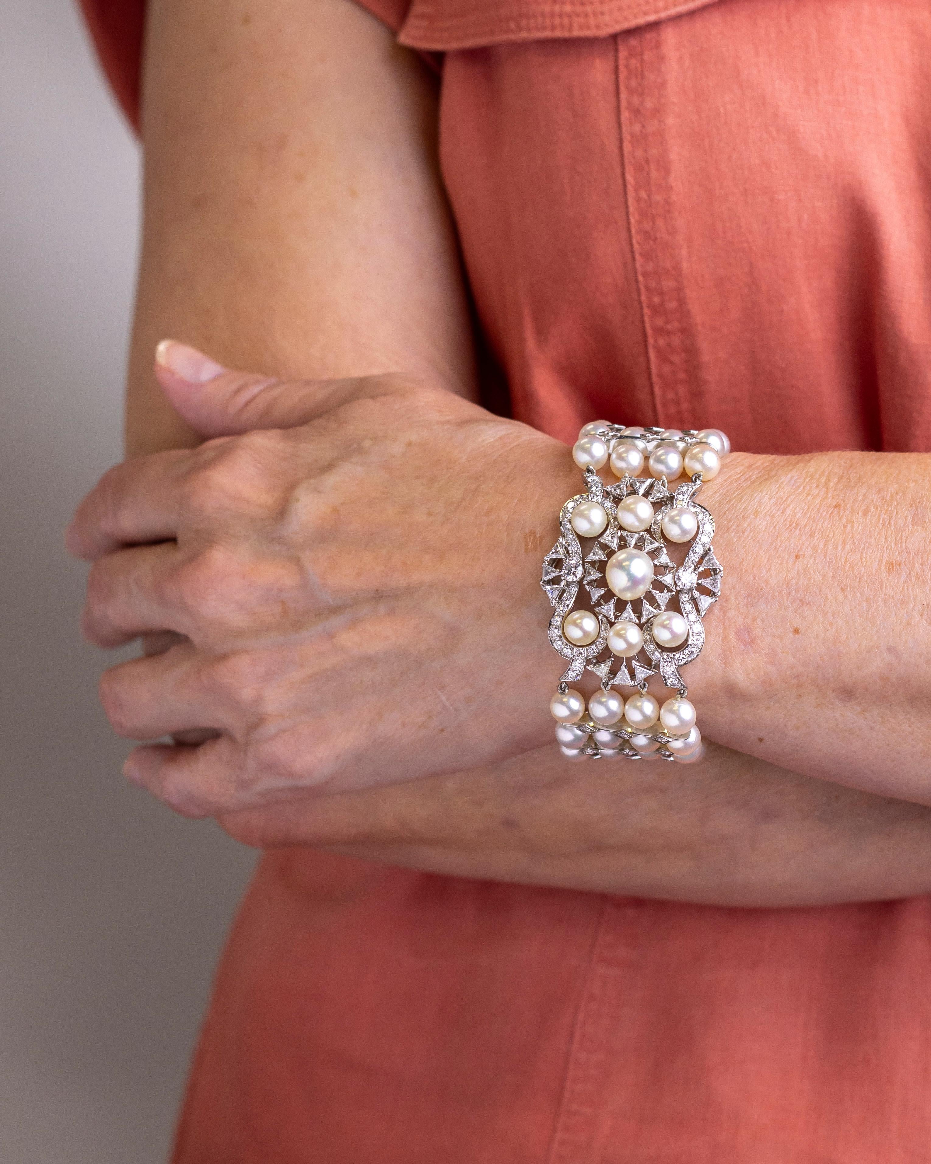 This knockout bracelet which dates to the 1960s was retailed by Miami based jeweller David R. Balogh and has been crafted from platinum, diamonds and cultured pearls. The bracelet has a central plaque that features a cluster of diamonds and pearls,