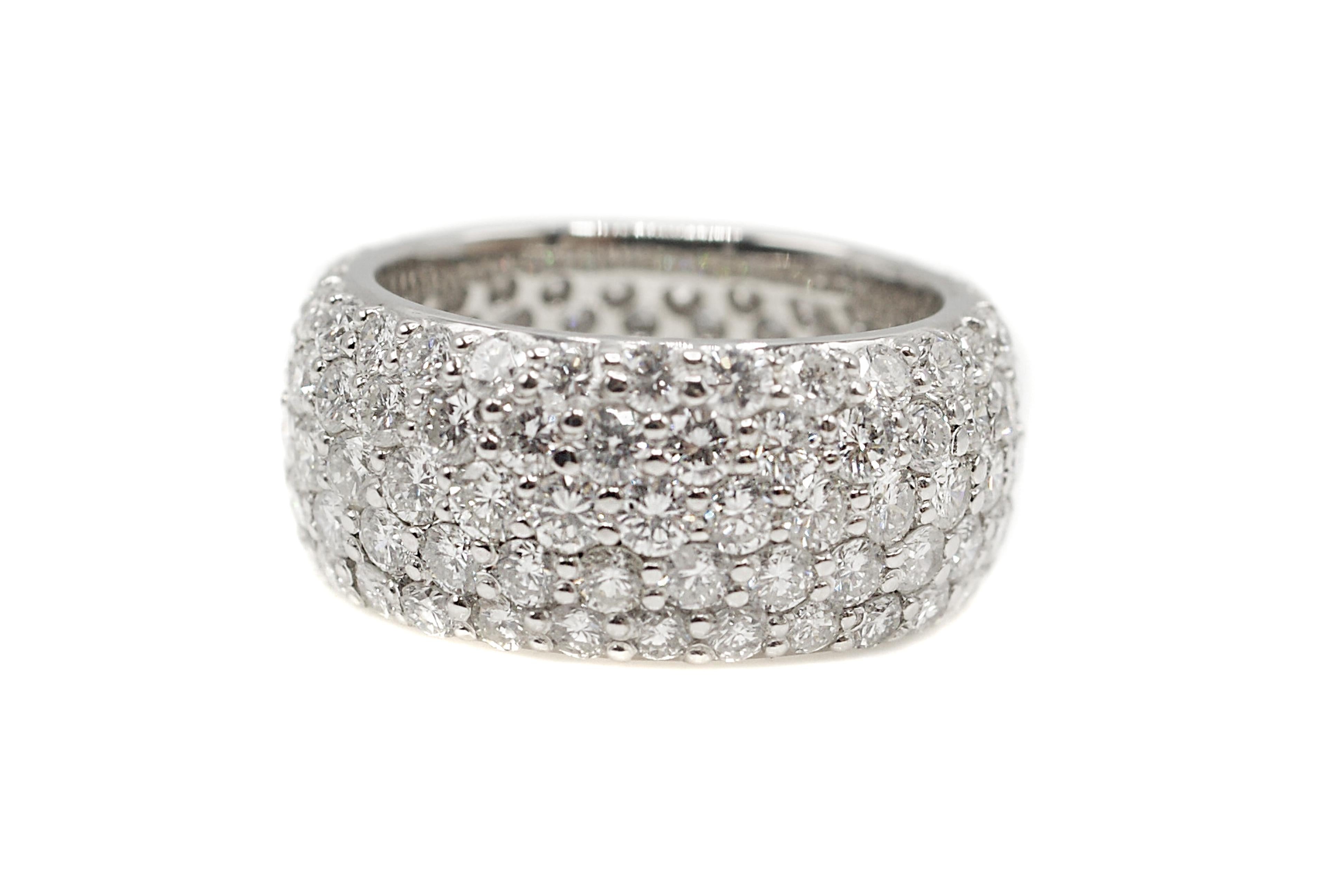 This impressive incredibly well hand-crafted eternity band is set with 135 white, bright and sparkly round brilliant cut diamonds. The 5 rows of diamonds which elegantly slightly curve over the finger are bead set with diamonds which are perfectly