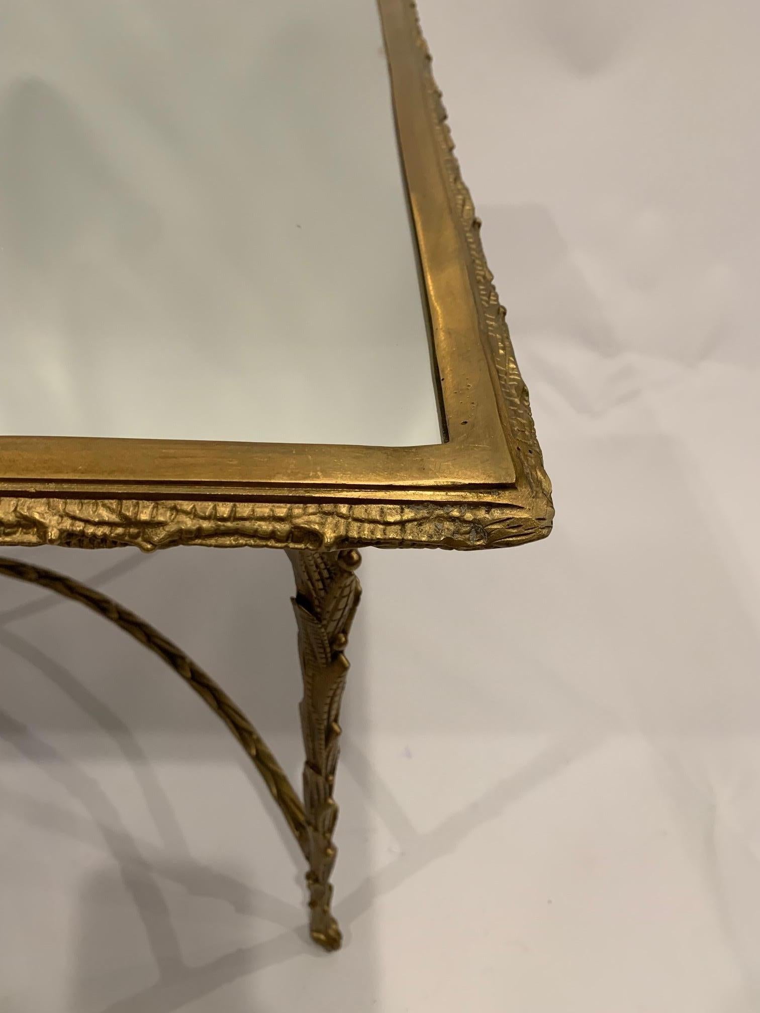 Very elegant burnished brass rectangular coffee table having gorgeous detailing and mirrored surface.
 