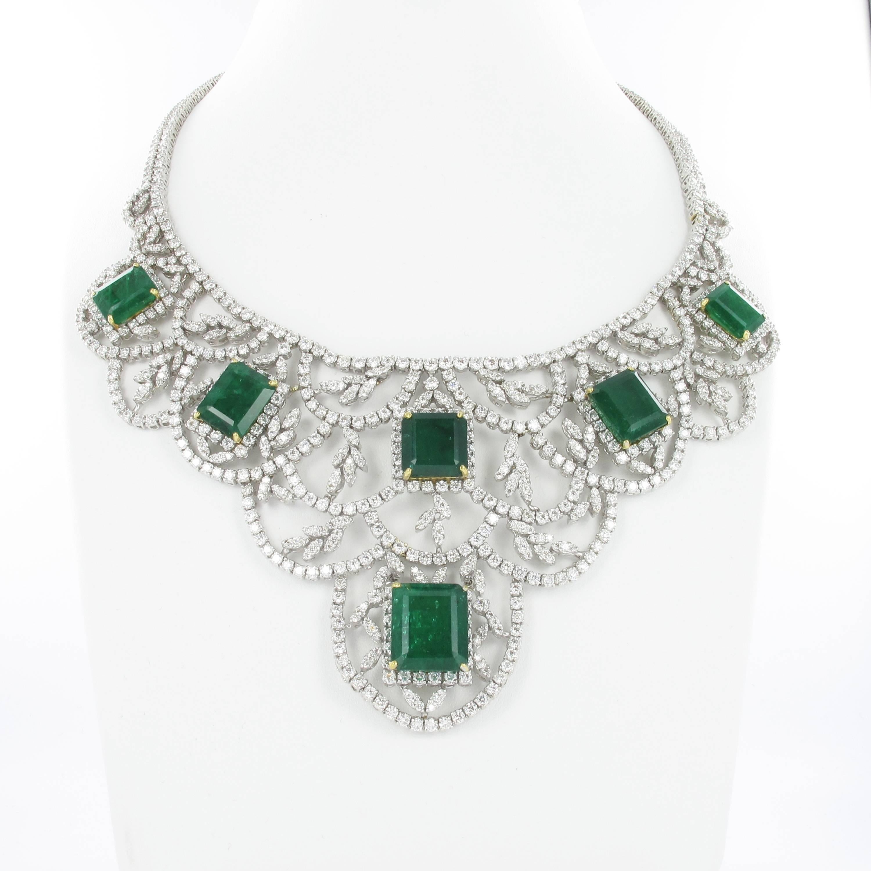 A full set consisting of necklace, bracelet, ear hangers and ring. 14 emeralds of approximate 78 ct in total are the main attraction in this impressive parure. The astonishing number of 1754 round cut diamonds weighing approximate 62 ct in total