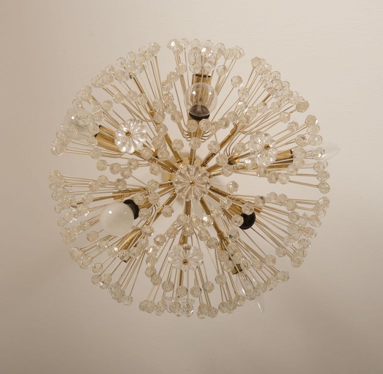 Emil Stejnar snowball chandelier form 1960s, brass construction and gold colored socket covers accented with crystal flowers and beads. 
Eight E14 sockets.
 