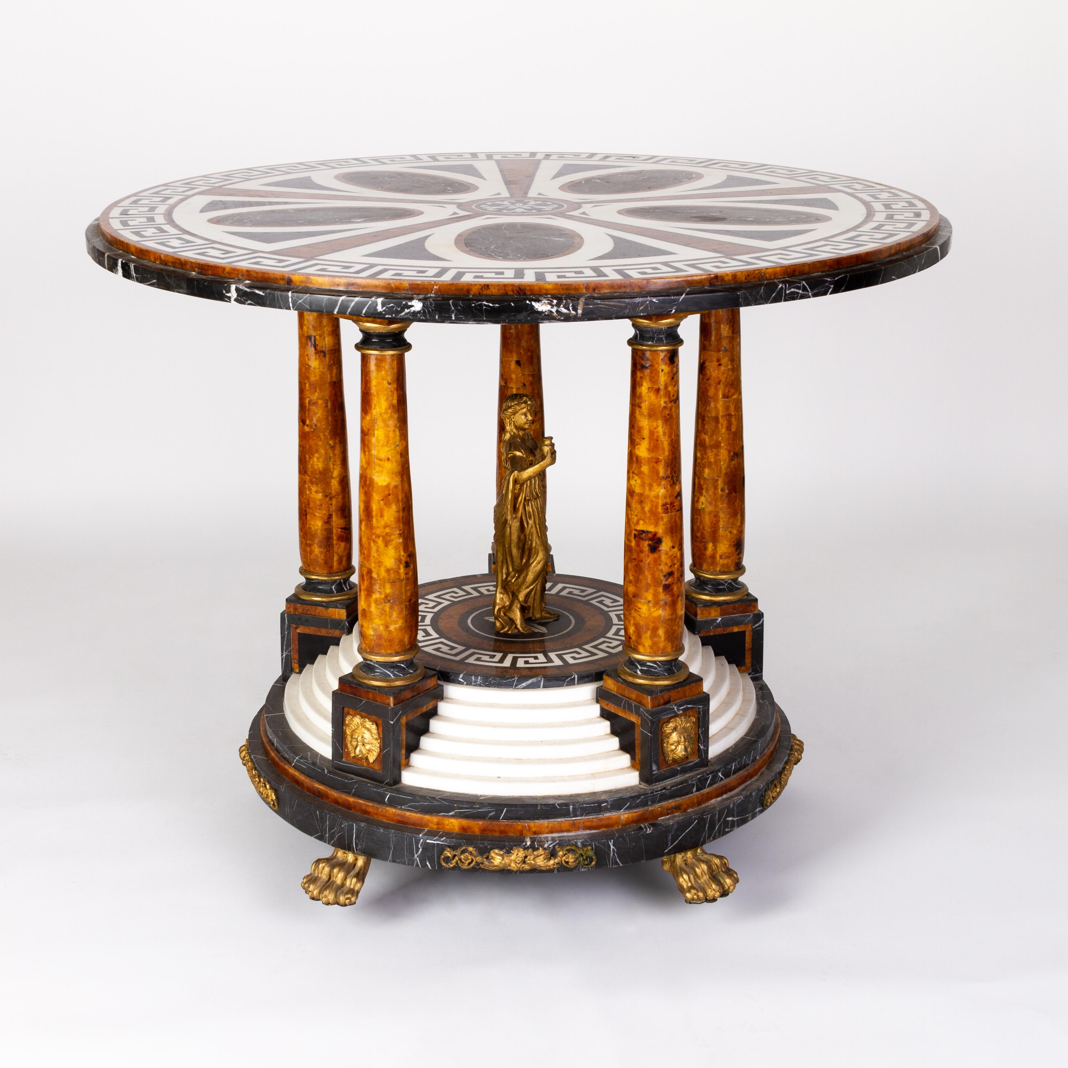 Impressive Empire Italian Pietra Dura Ormolu Exotic Marble Grecian Style Table 
Good condition.
A remarkable late 19th century Empire-revival table. The exotic marble top and base inlaid in Greek keys, decorated with a central robed figure. On burr