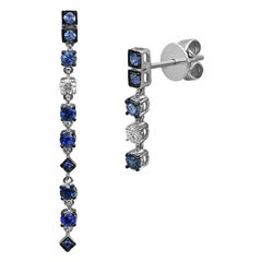 Pendants d'oreilles impressionnants en or blanc avec saphir bleu fantaisie et diamants