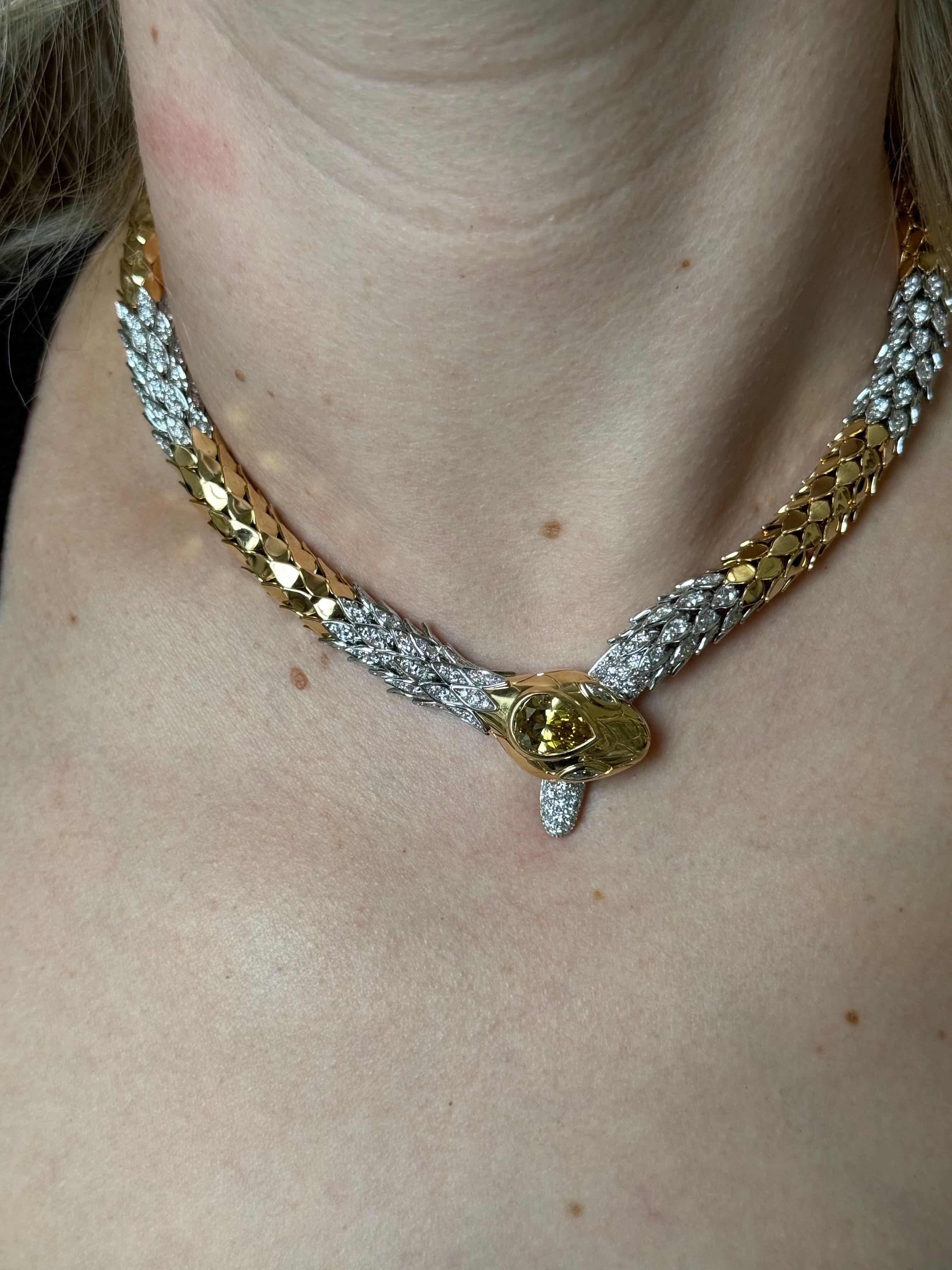 An impressive 18k gold and platinum snake necklace by Faraone, featuring approx. 6.00ctw G/VS diamonds on the necklace, and a center fancy cognac pear shape diamond - approx. 3.60ct VS-Si1. Necklace is 17