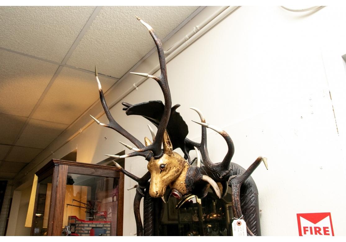 Rustic Impressive Figural Stag Head Mirror Garnished with Faux Antlers & Tusks For Sale