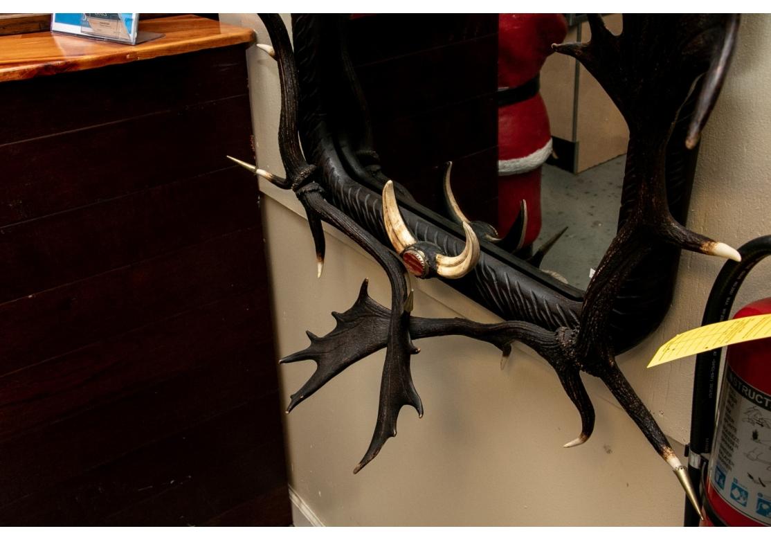 20th Century Impressive Figural Stag Head Mirror Garnished with Faux Antlers & Tusks For Sale