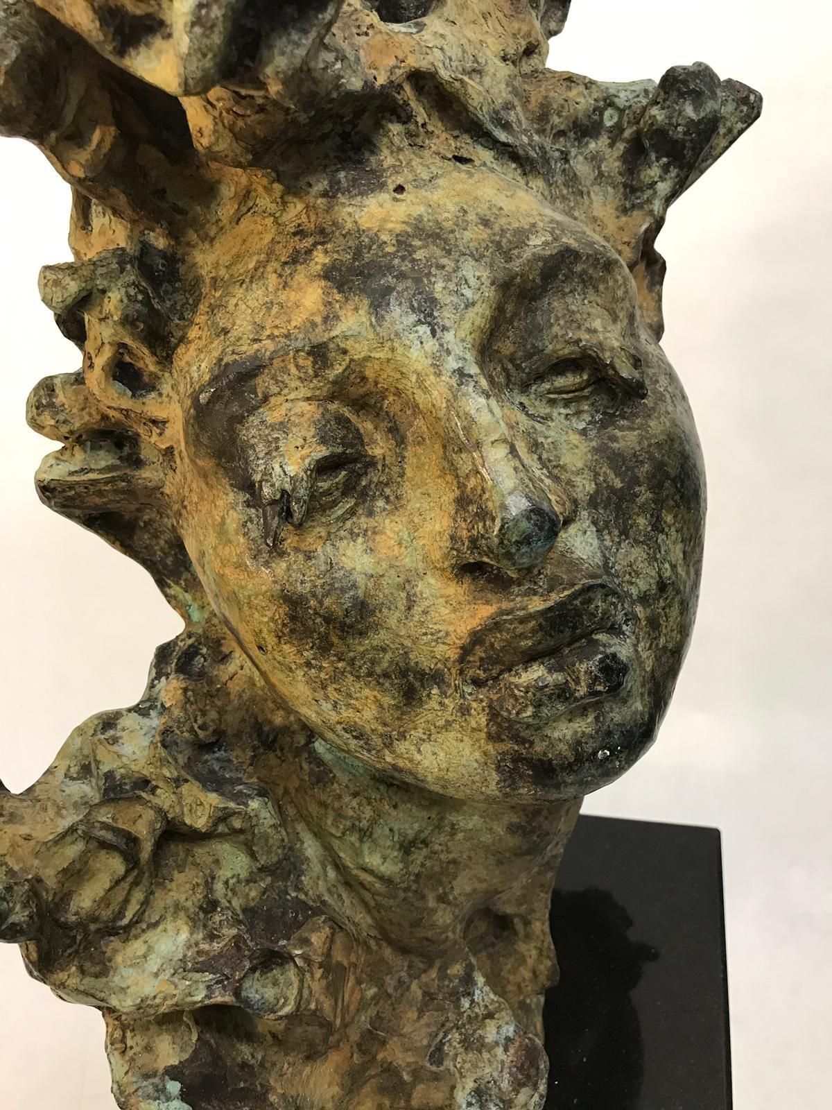 Mounted on black granite base, this expressive and beautiful bust in verdigris bronze can be appreciated from all angles. The art of Javier Marin offers a singular vision of the human spirit. If only one word in the English language described the