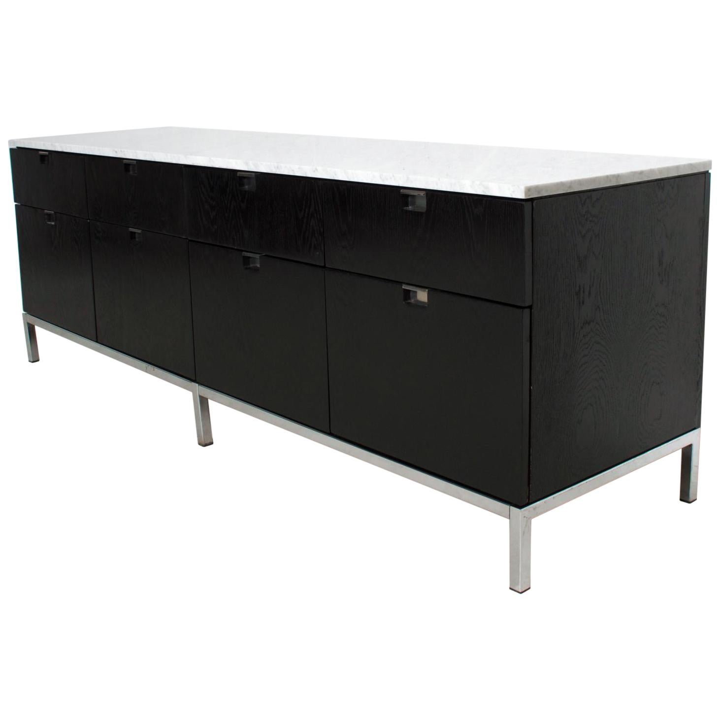  Modern  elegance Florence Knoll credenza cabinet sideboard with white Carrara marble in black oak circa 1960s by Knoll.
Stamped with Knoll label in the upper drawer. Ebonized oak with white Carrara marble top.
Original chrome-plated base. Finished