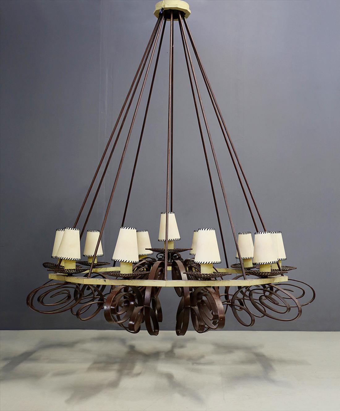 Impressive and large French ceiling chandelier from the early 1940s. Made in Art Deco style with a painted metal frame. The structure is truly imposing and grand. Pyramidal in shape with curved metal decorations at the base in the shape of a purely