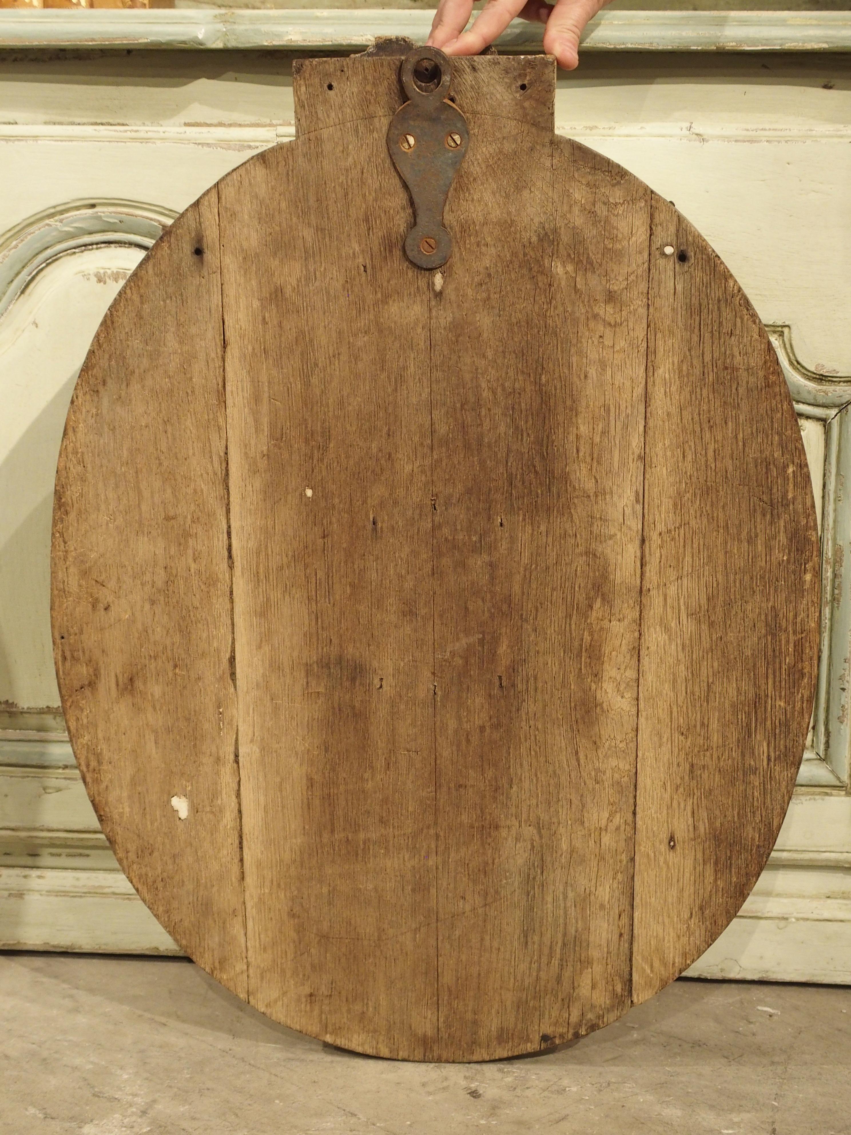 This incredibly detailed stripped oak oval medallion plaque depicting the profile of a monk comes from France, circa 1860.

Our monk is turned to his left, so that the right side of his face is visible. The expressionless monk has a tonsure